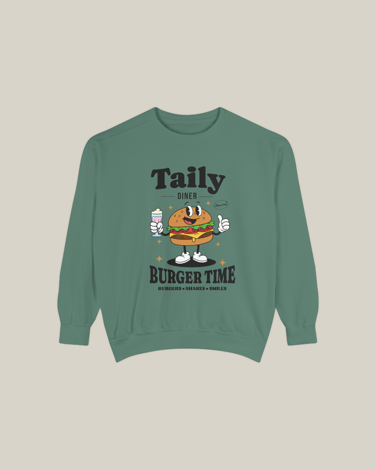 Light green Taily Diner Burger Time sweatshirt featuring a cheerful burger mascot and slogan Burgers • Shakes • Smiles.