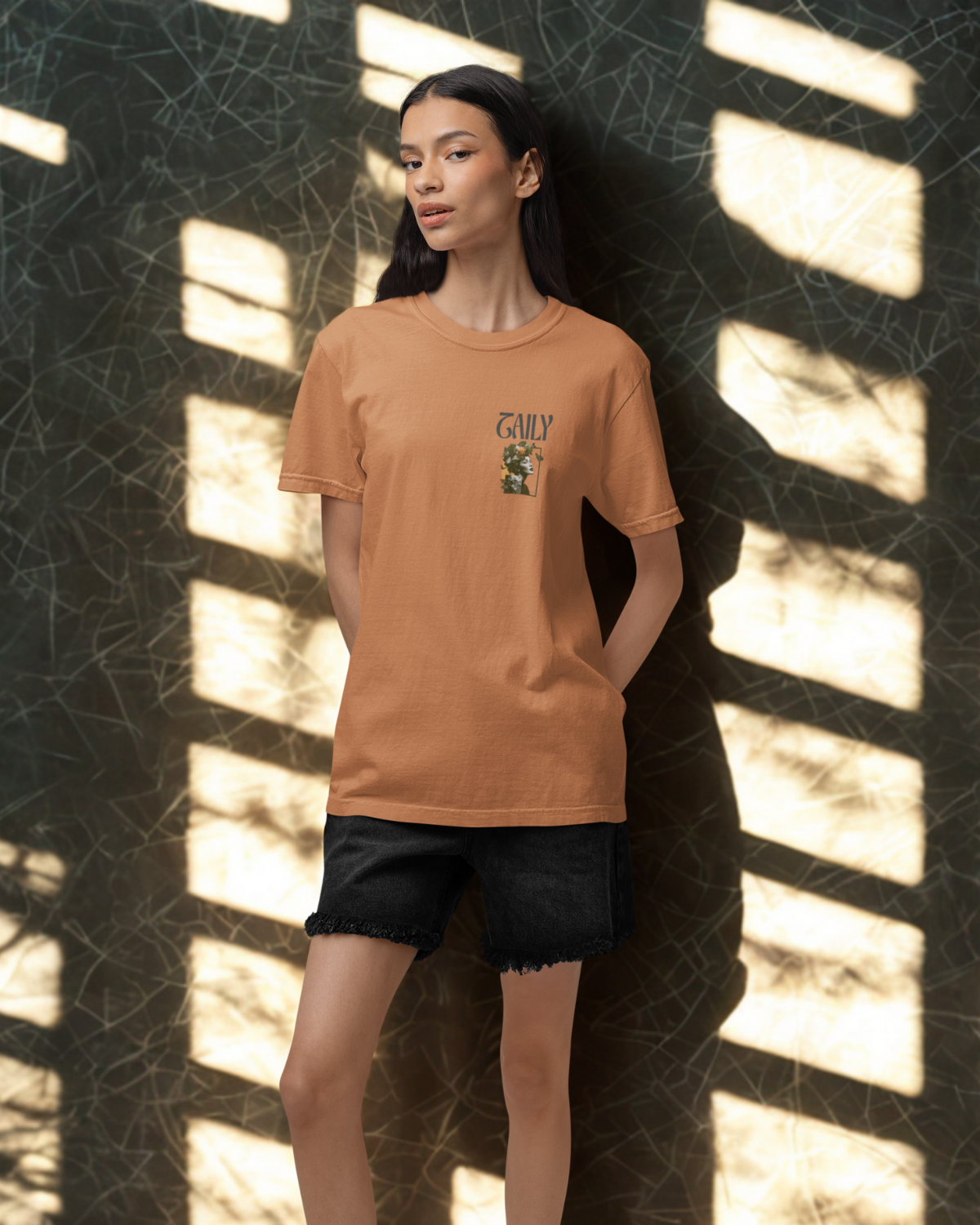 Model wearing Taily Wonders Vintage Boxy Tee in toast, showcasing retro art on a relaxed fit t-shirt.