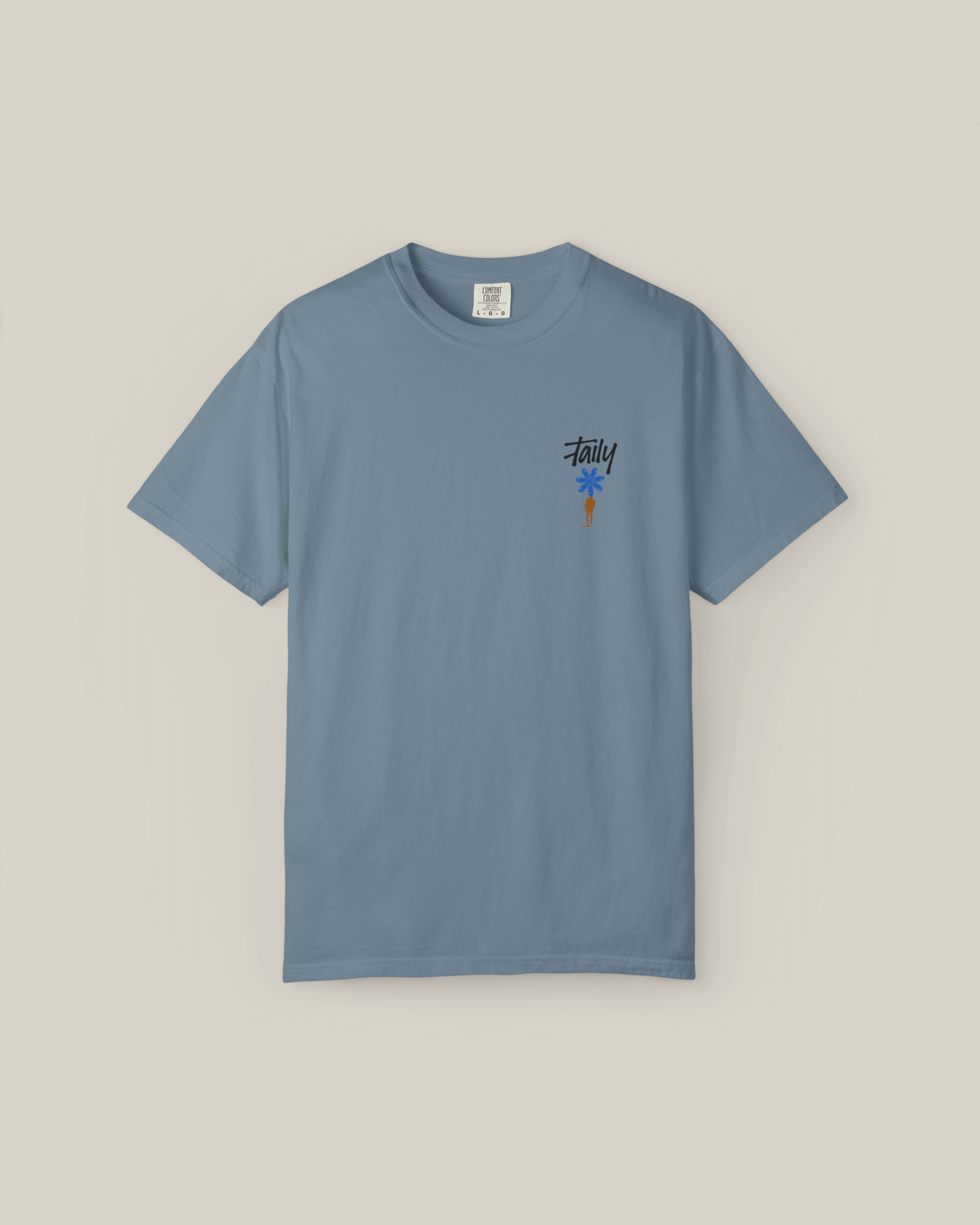 Taily Bloom Tee in ice blue, featuring a chest logo and bold design, a stylish streetwear graphic t-shirt.
