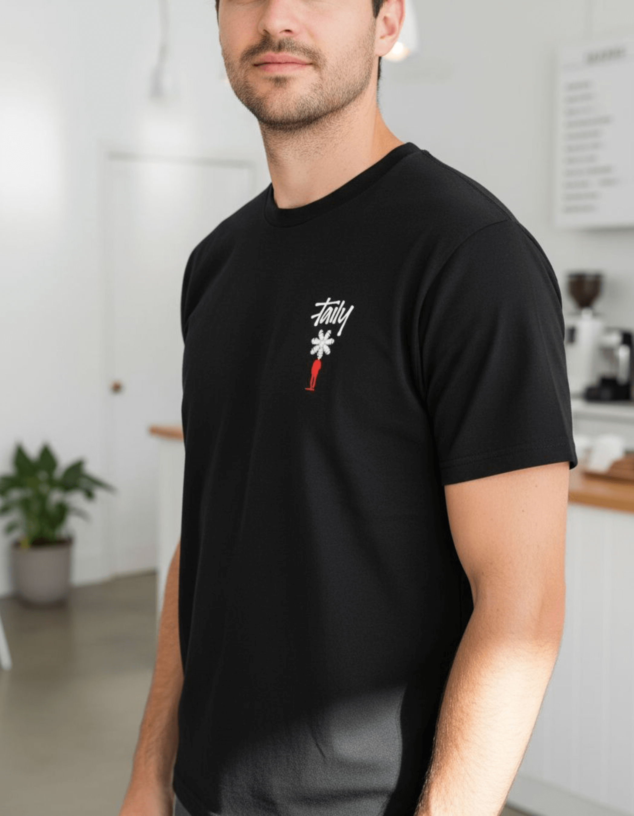 Man wearing Taily Bloom Streetwear Graphic T-shirt in black, featuring chest logo and bold design.