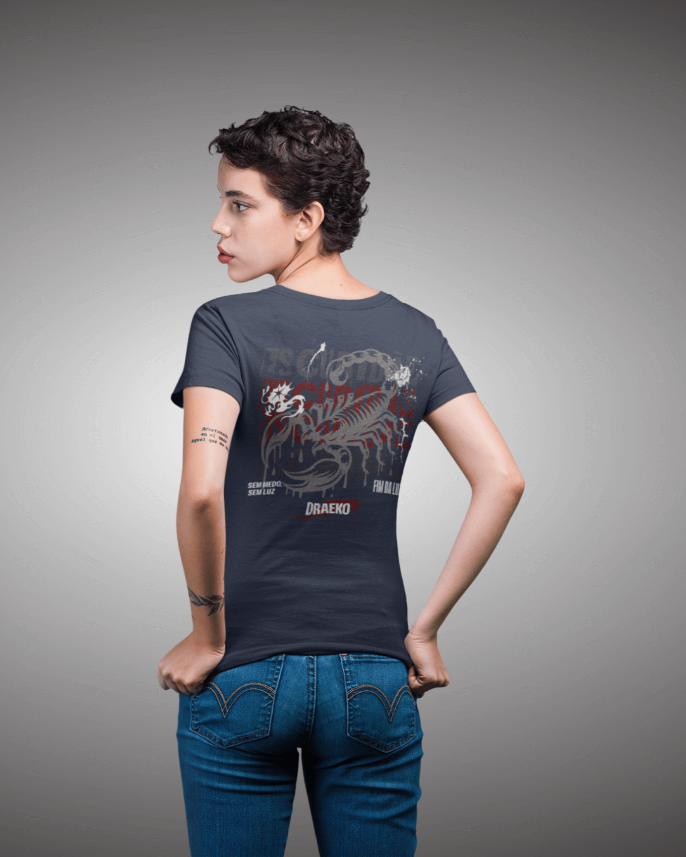 Back view of Taily Scorpion graphic t-shirt in navy featuring bold scorpion artwork and minimal chest logo.