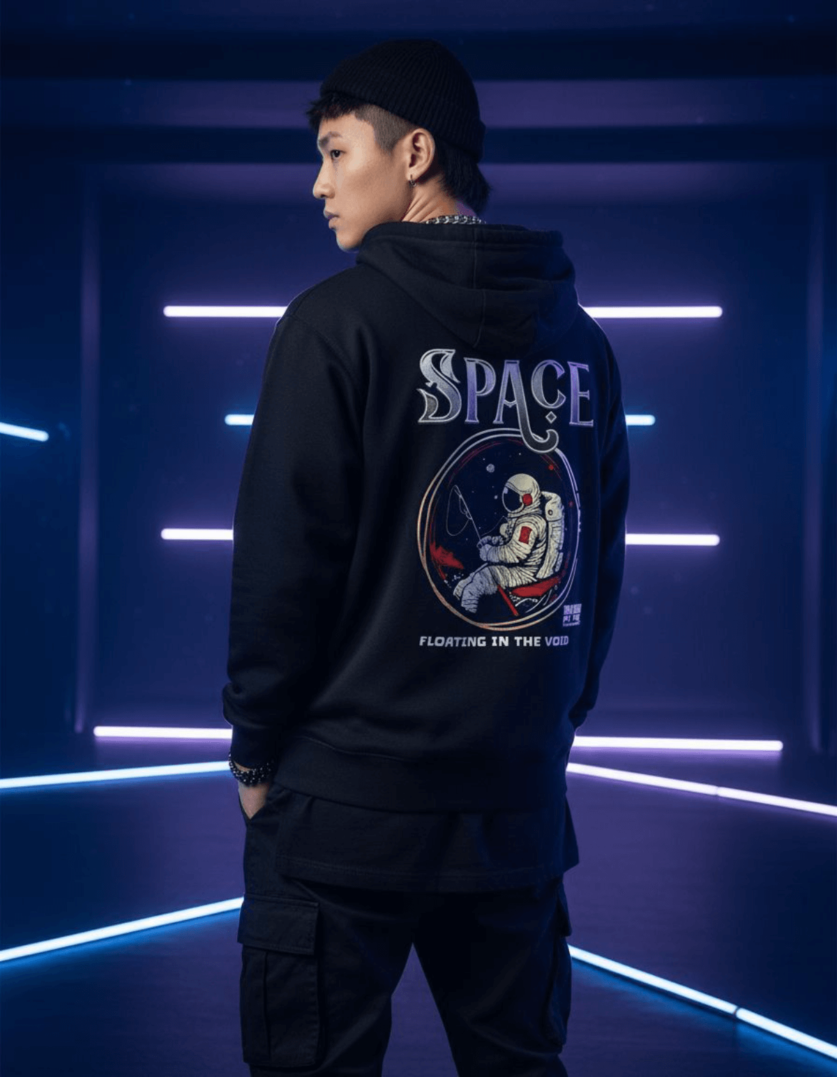 Model wearing Taily “Space Club” Streetwear Graphic Hoodie in black with astronaut design.