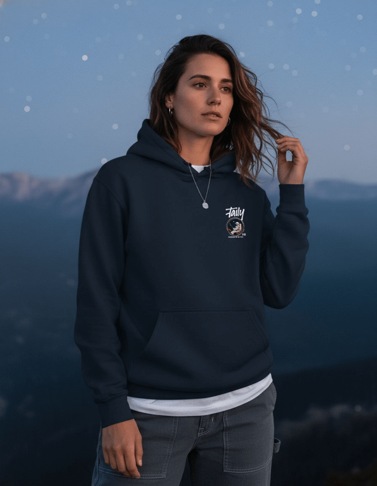Taily Space Club Streetwear Graphic Hoodie in navy worn by a model outdoors against a starry sky.