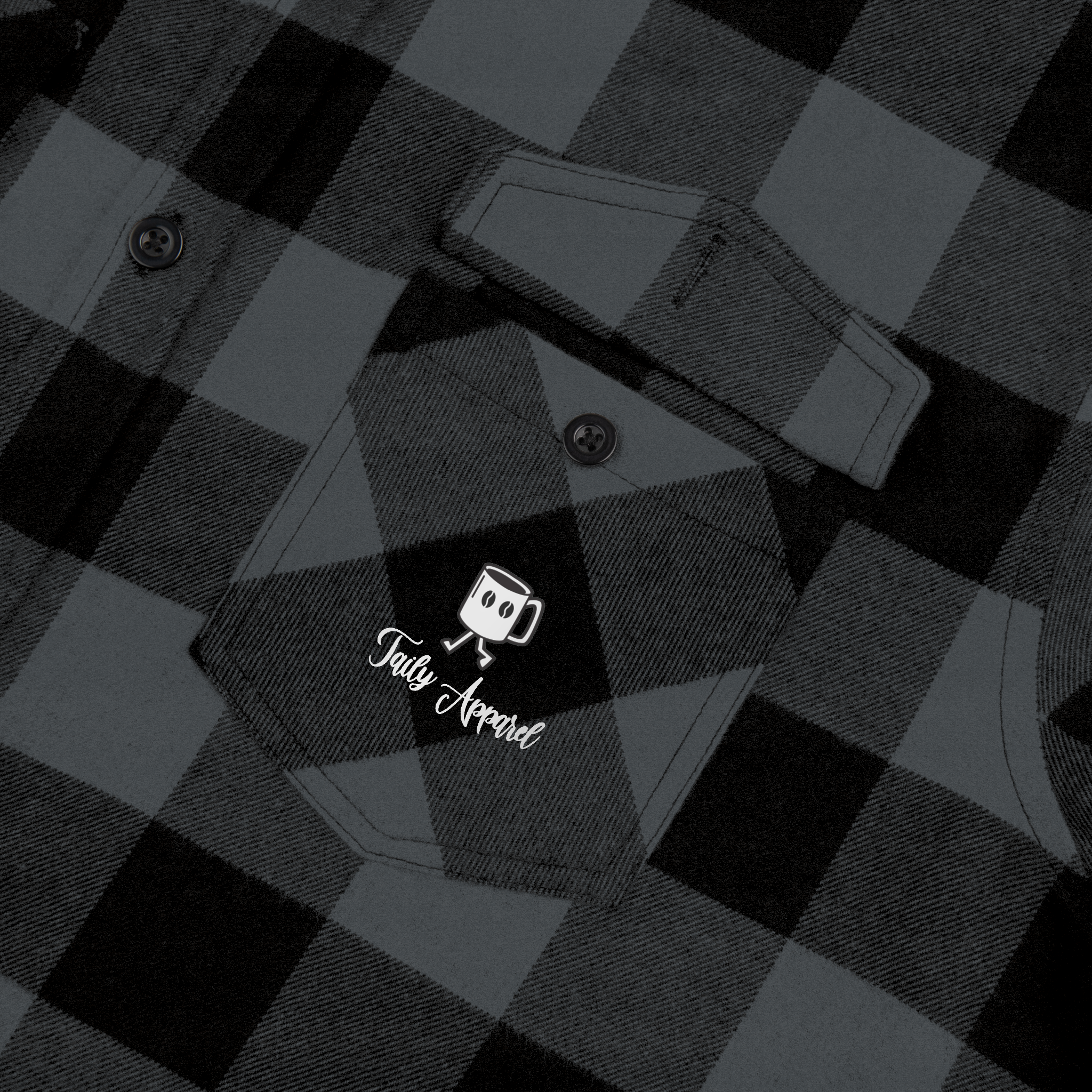 Taily Coffee flannel shirt pocket detail with logo on charcoal heather checkered fabric.