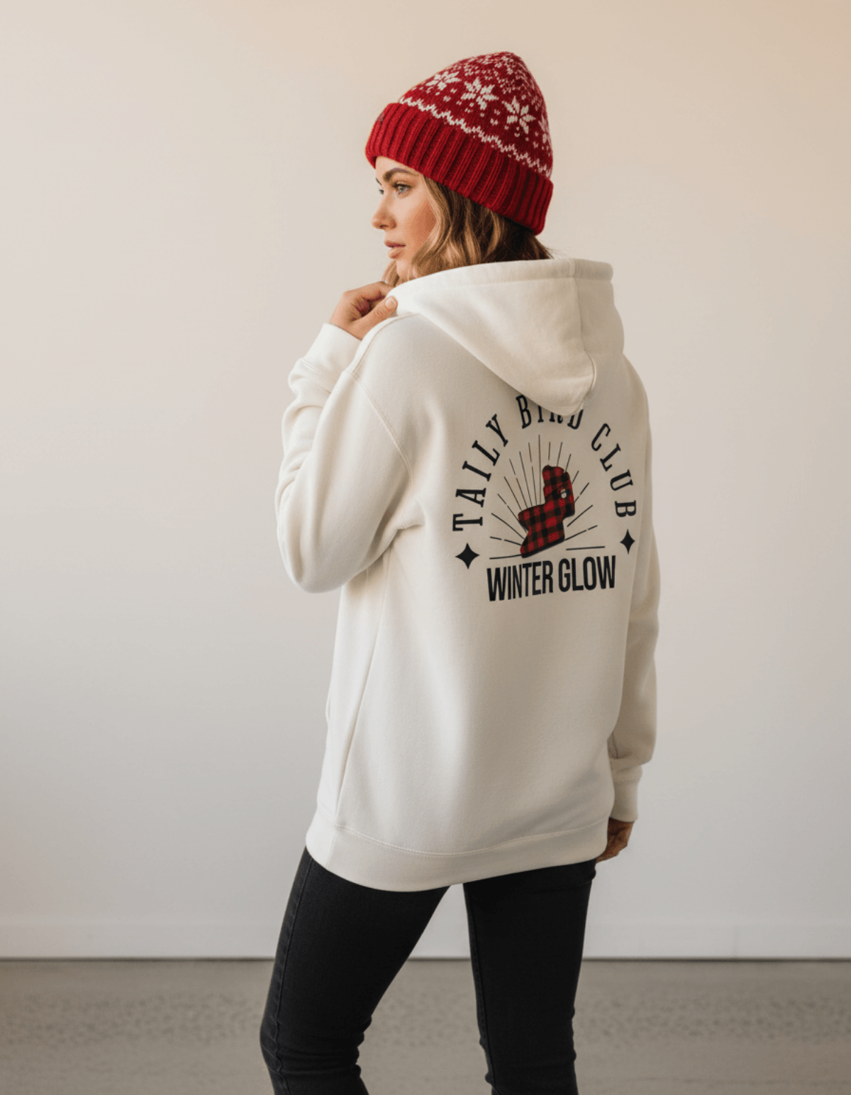 Taily Bird Club Winter Glow Hoodie – Bone shown from back with Winter Glow graphic and red beanie.