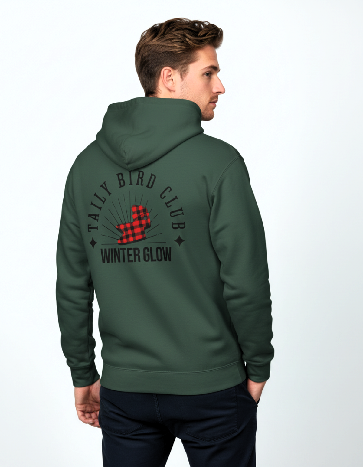 Man wearing Taily Bird Club Winter Glow Hoodie in Alpine Green, showcasing the back graphic design.