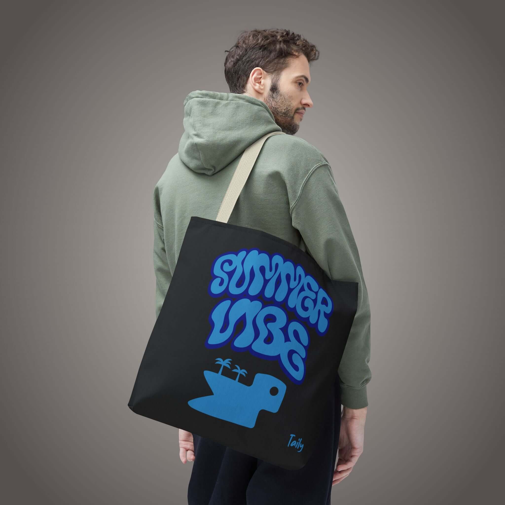SUMMER VIBE tote bag on a model, featuring all-over graphic print and a fun blue design.