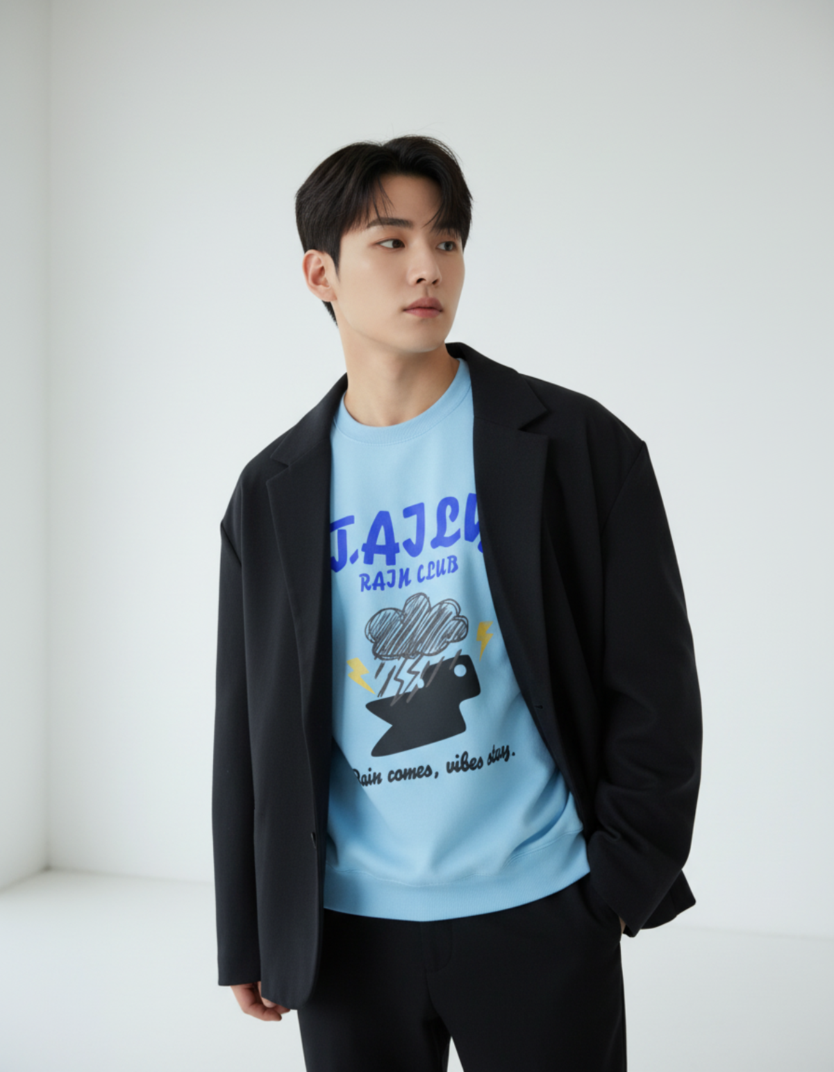 Model wearing Taily Rain Club sweatshirt in Sky with cloud and lightning design.