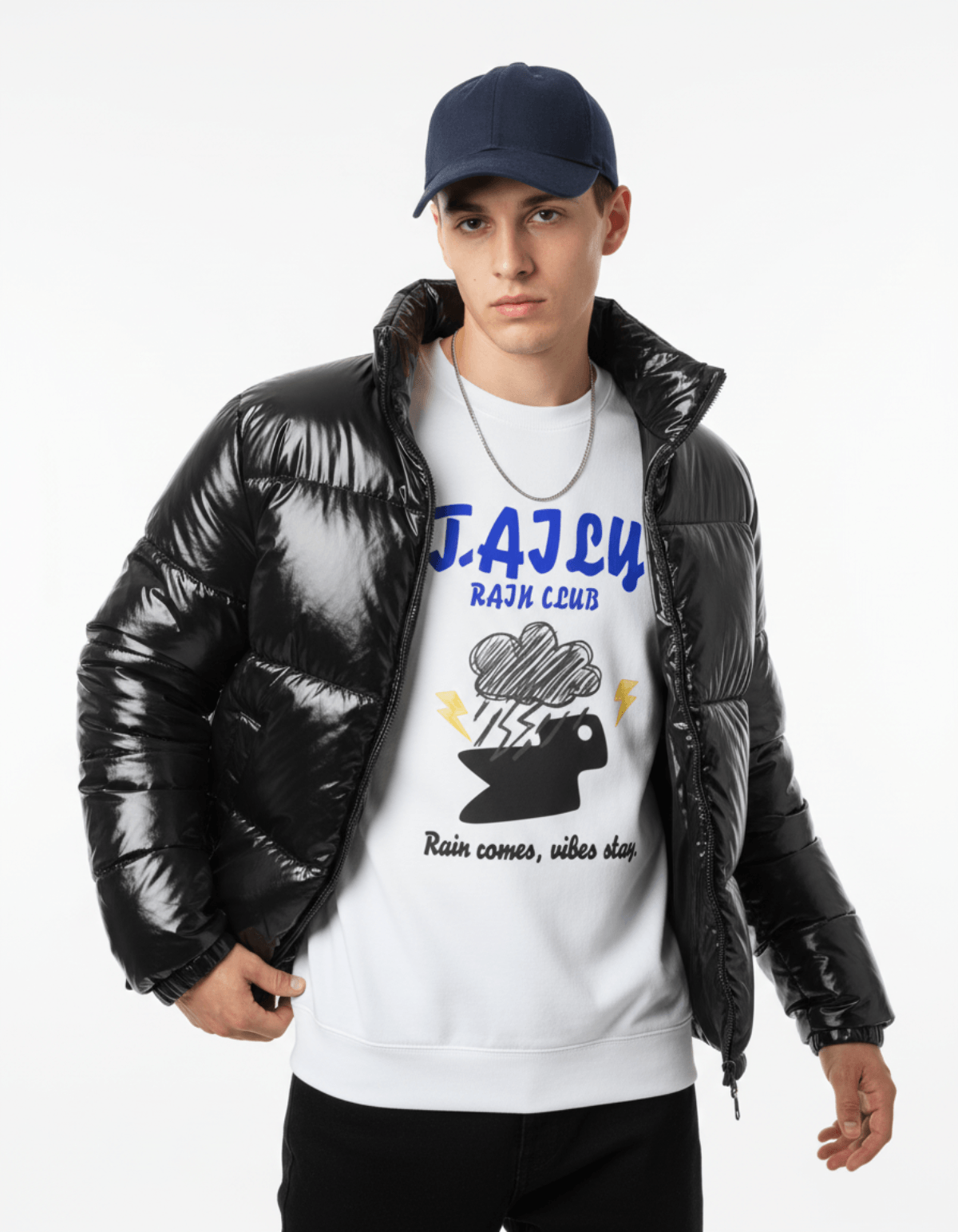Model wearing Taily Rain Club sweatshirt in white with a black puffer jacket, showcasing storm cloud design.