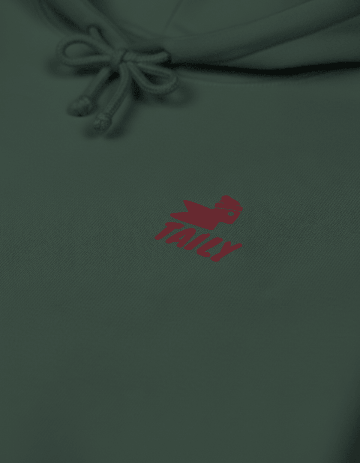 Close-up of Taily Bird Parkland Hoodie – Alpine Green featuring red front logo design on a green background.