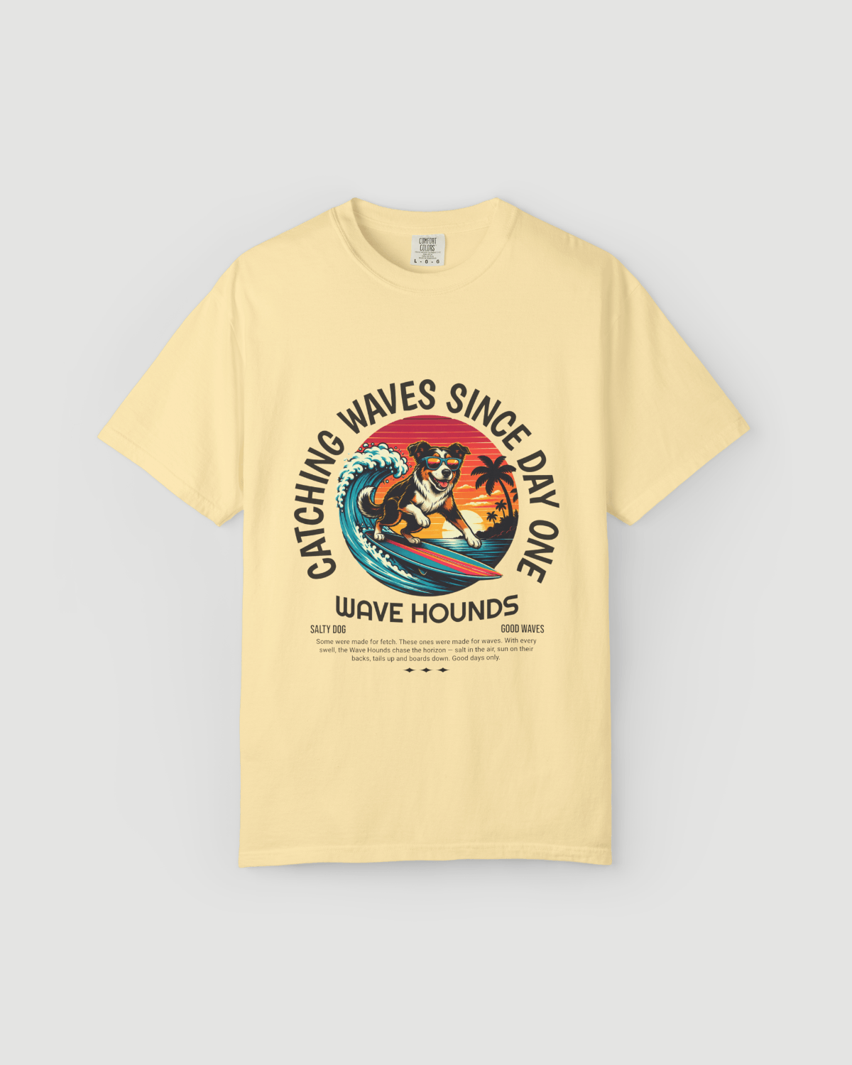 Wave Hounds Surf Tee – Banana featuring retro surf graphic on a heavyweight garment-dyed tee in banana color.