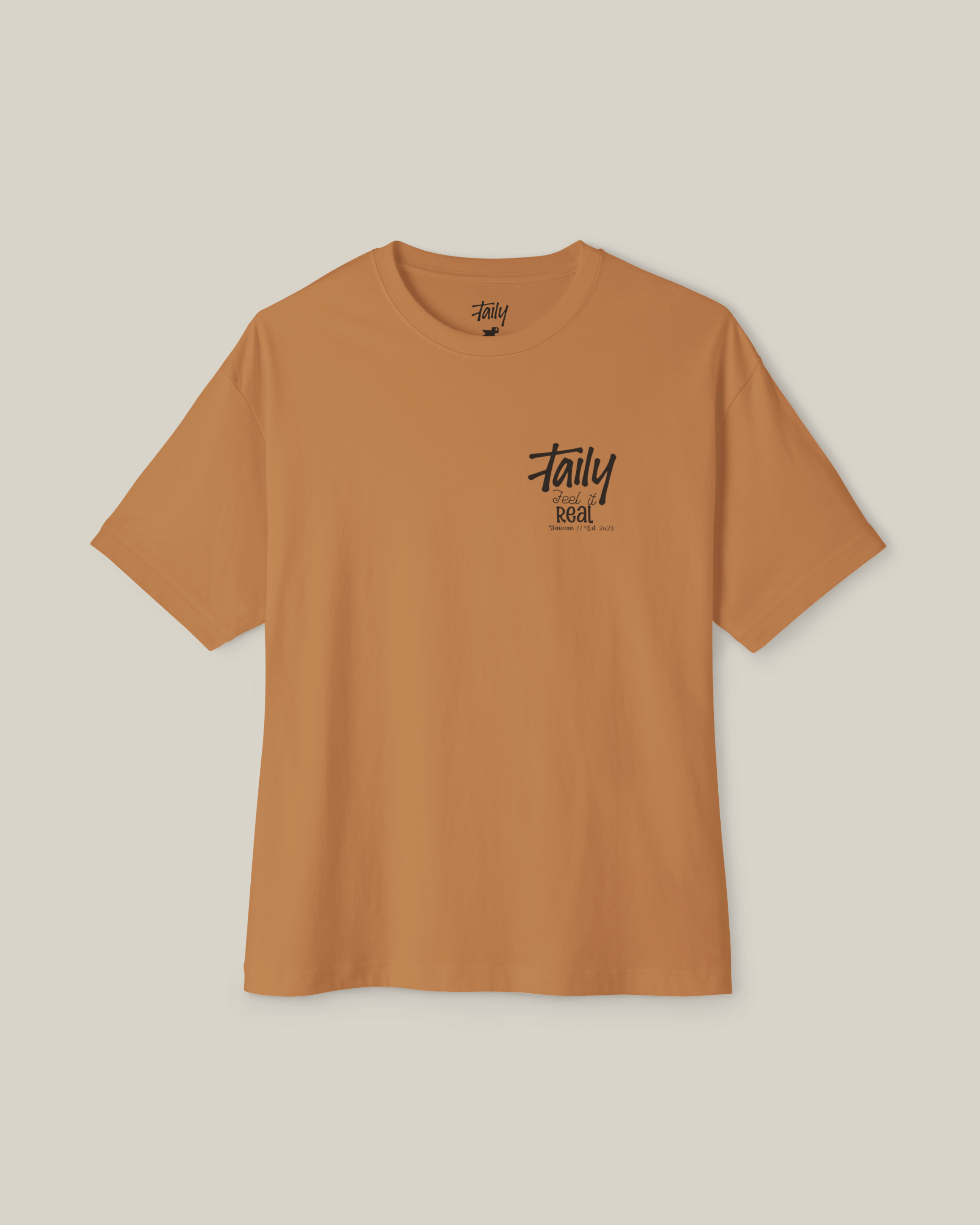 Taily Feel It Real Boxy Tee in toast, a streetwear boxy t-shirt featuring chest logo and bold lettering.