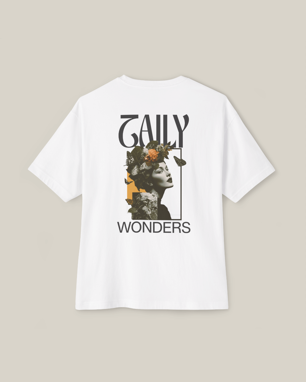 Taily Wonders vintage boxy t-shirt featuring floral and butterfly design on the back in white.