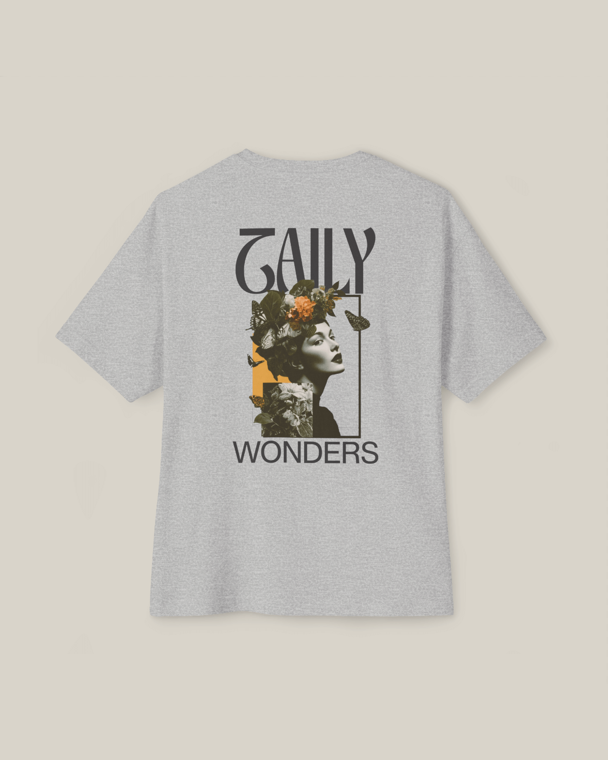 Vintage boxy t-shirt in athletic gray featuring artistic floral portrait design on back.
