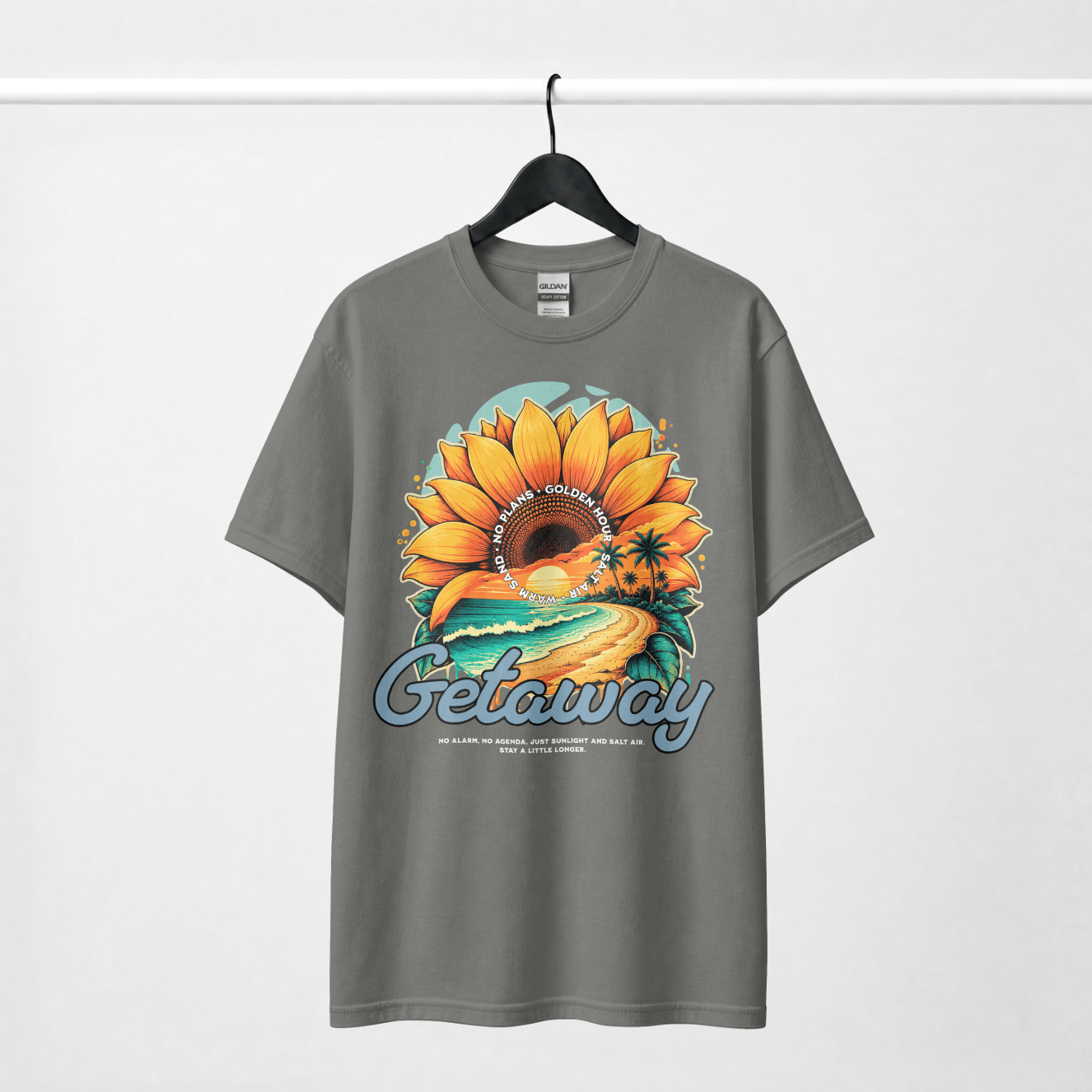 Getaway Sunflower Beach Tee – Pepper featuring a vibrant sunflower design and coastal imagery on a gray shirt.