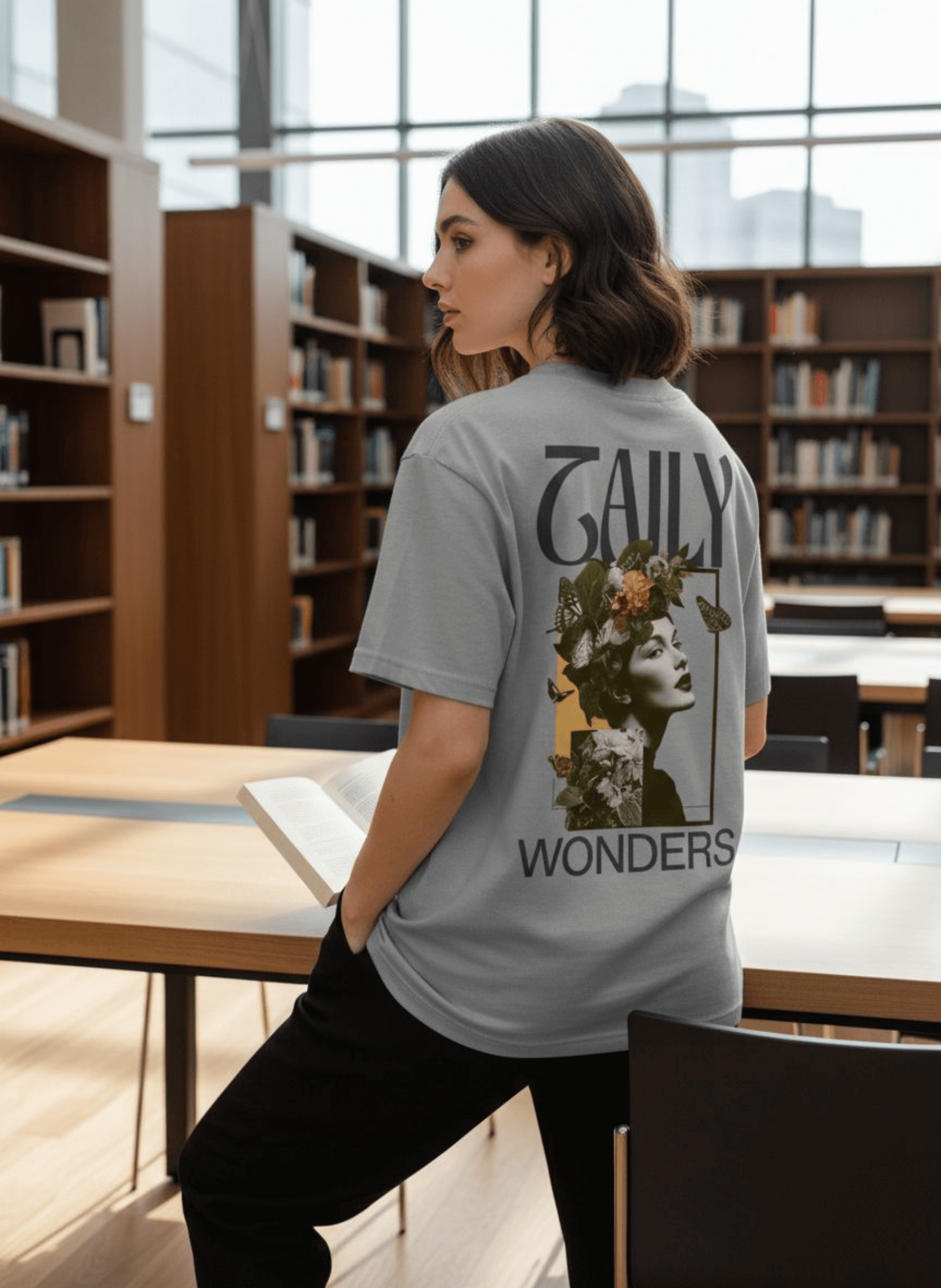 Model wearing Taily Wonders vintage boxy t-shirt in Athletic Gray, featuring a striking floral design on the back.