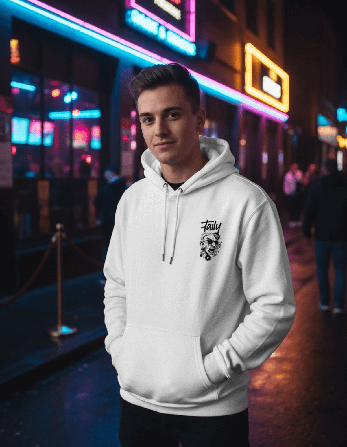 Taily Rage streetwear graphic hoodie in white worn by a model in an urban setting with neon lights.