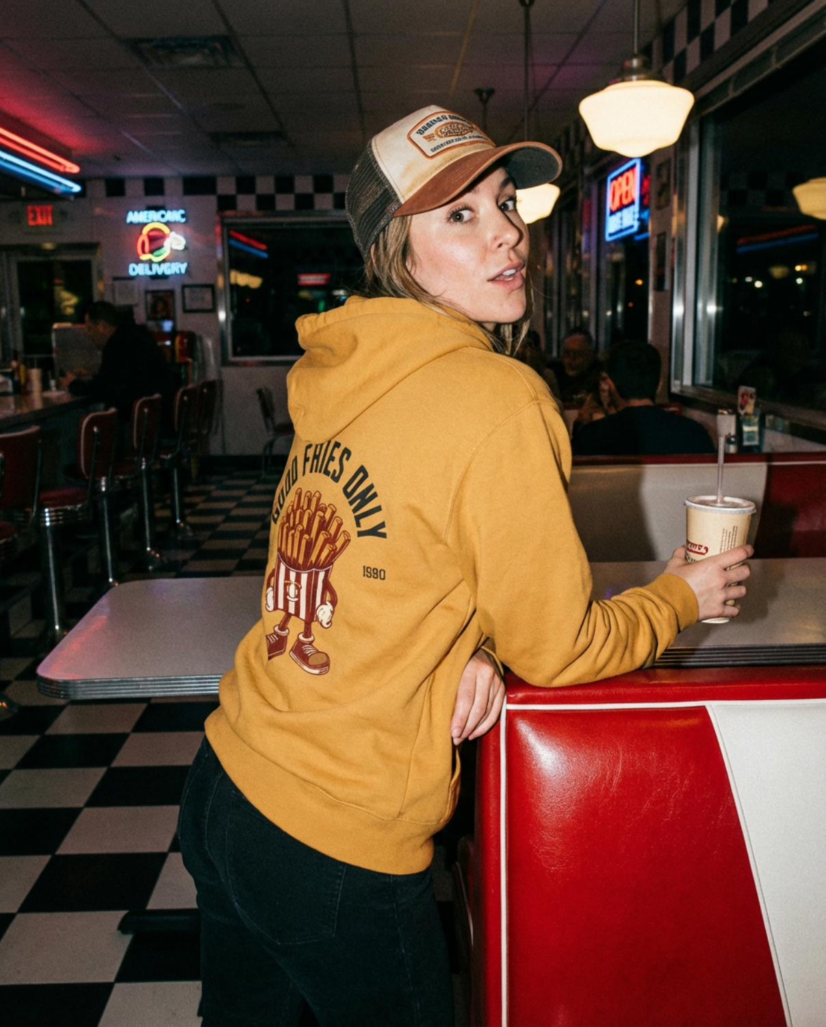 Good Fries Only Retro French Fries Hoodie – Mustard worn in a retro diner setting with a nostalgic vibe.