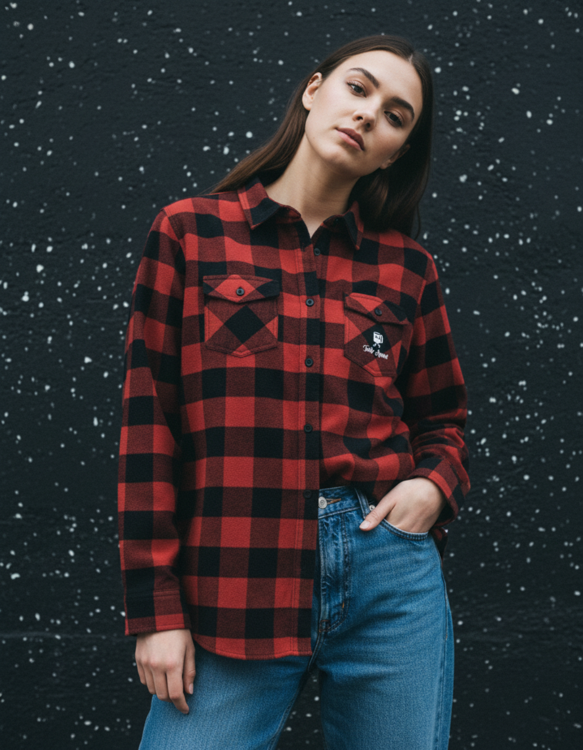 Taily Coffee flannel shirt in red with buffalo-plaid pattern worn by a model against a textured background.