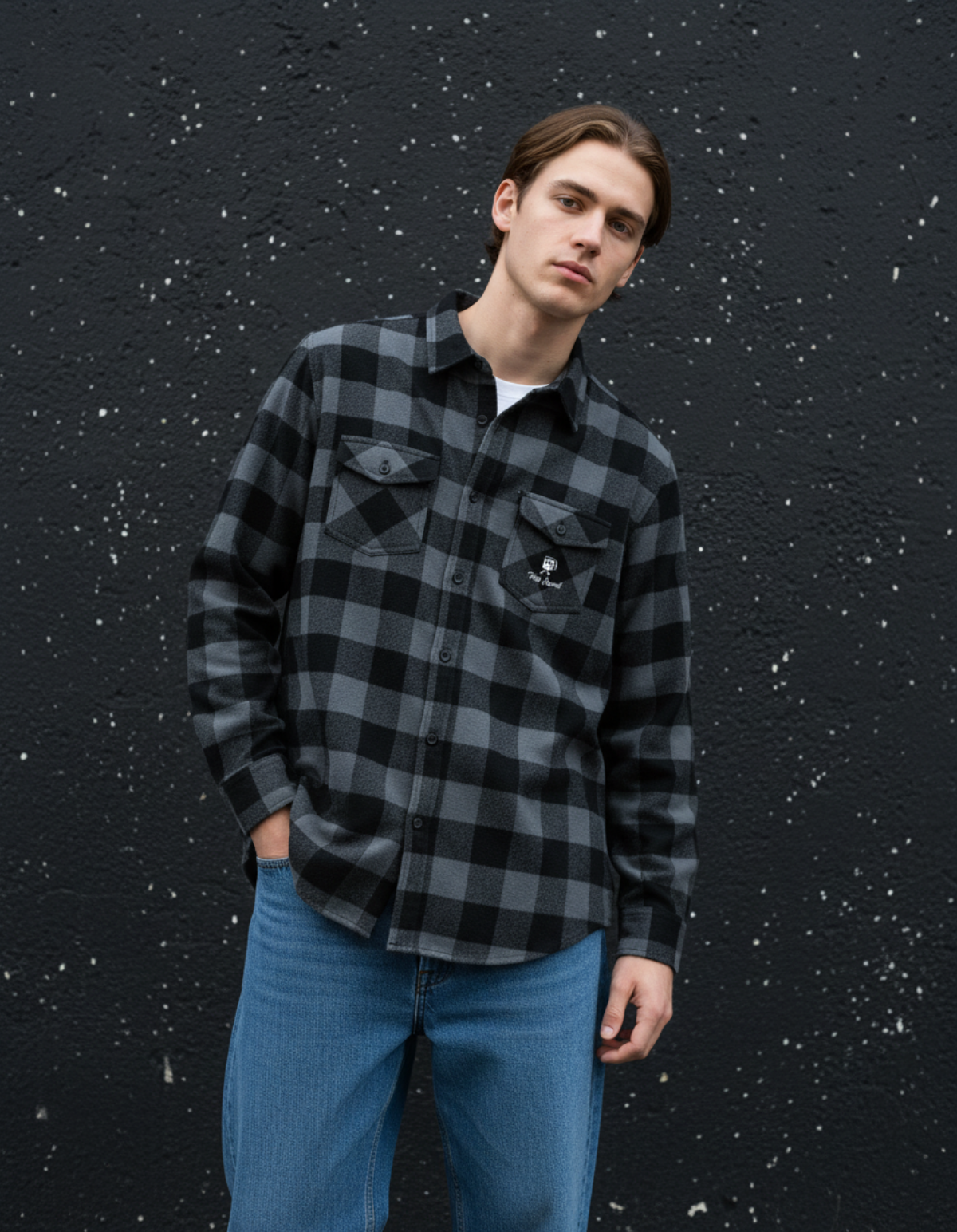 Model wearing Taily Coffee flannel shirt in Charcoal Heather against a dark wall, showcasing its soft brushed texture.