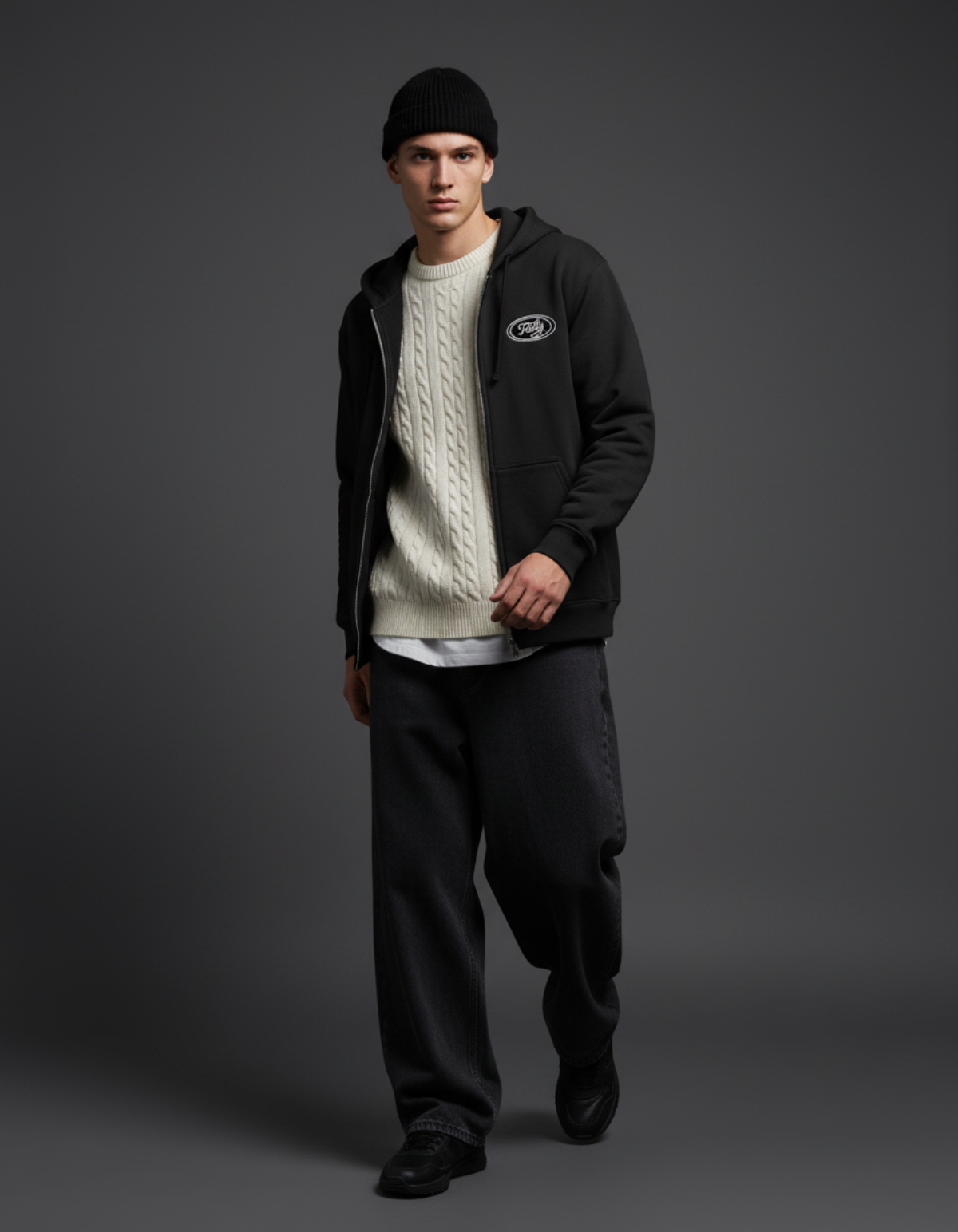 Model wearing Taily Zip Hoodie with sweater and pants in a stylish streetwear look.