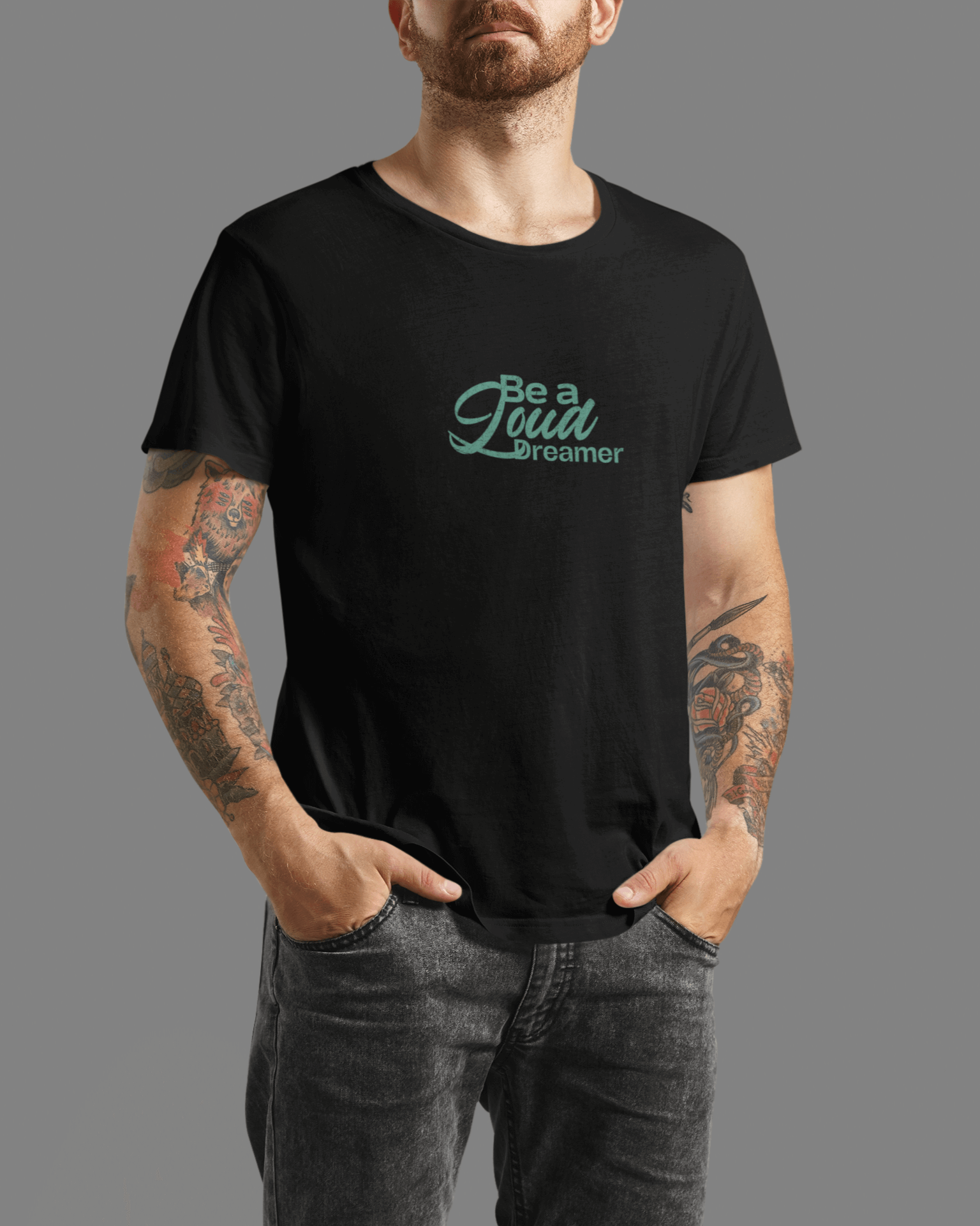 Men's black 'Be a Loud Dreamer' tee with minimal script design on soft cotton fabric.