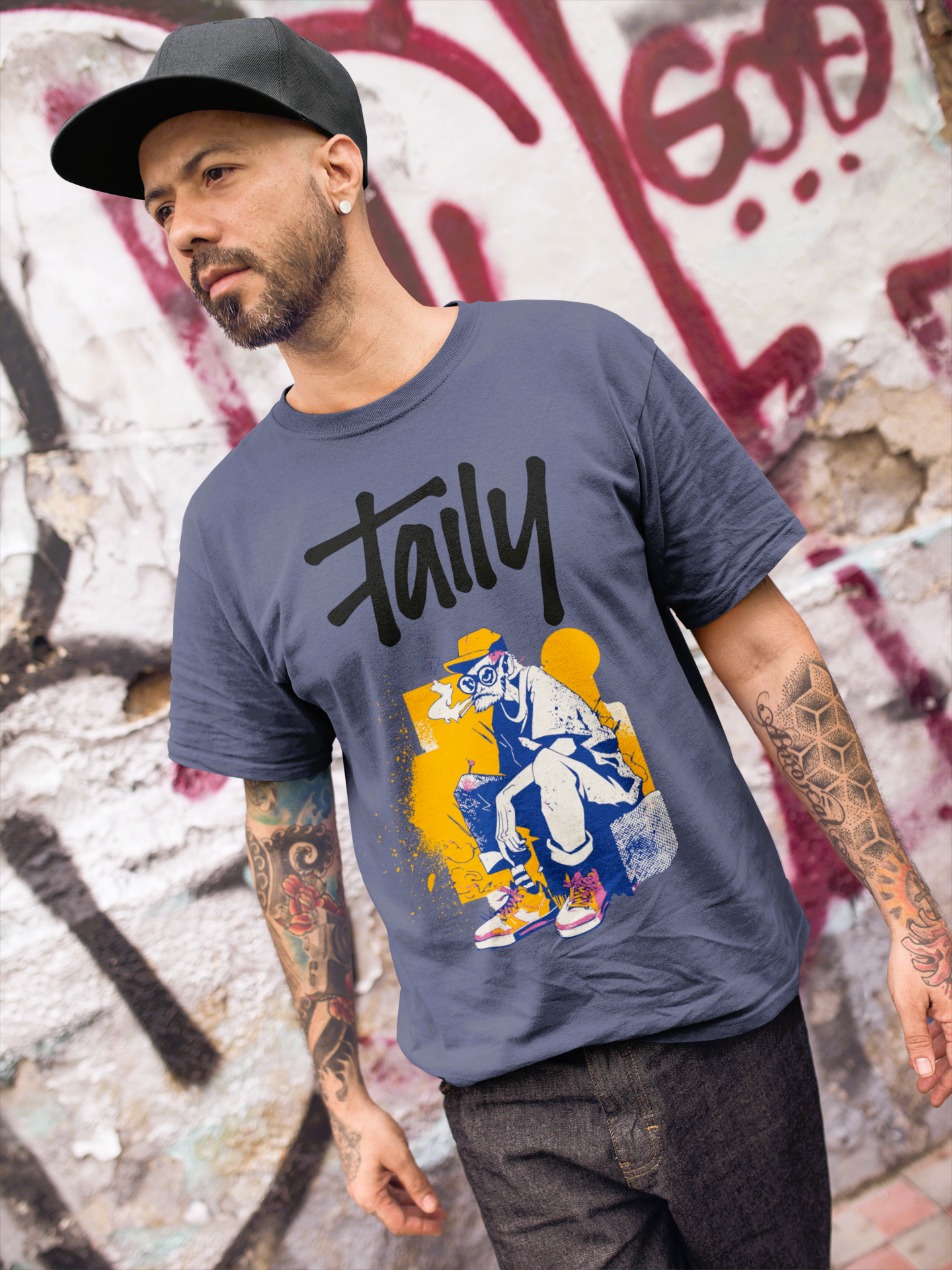 Man wearing Taily Street Rebel graphic tee in denim against graffiti background, showcasing streetwear style.