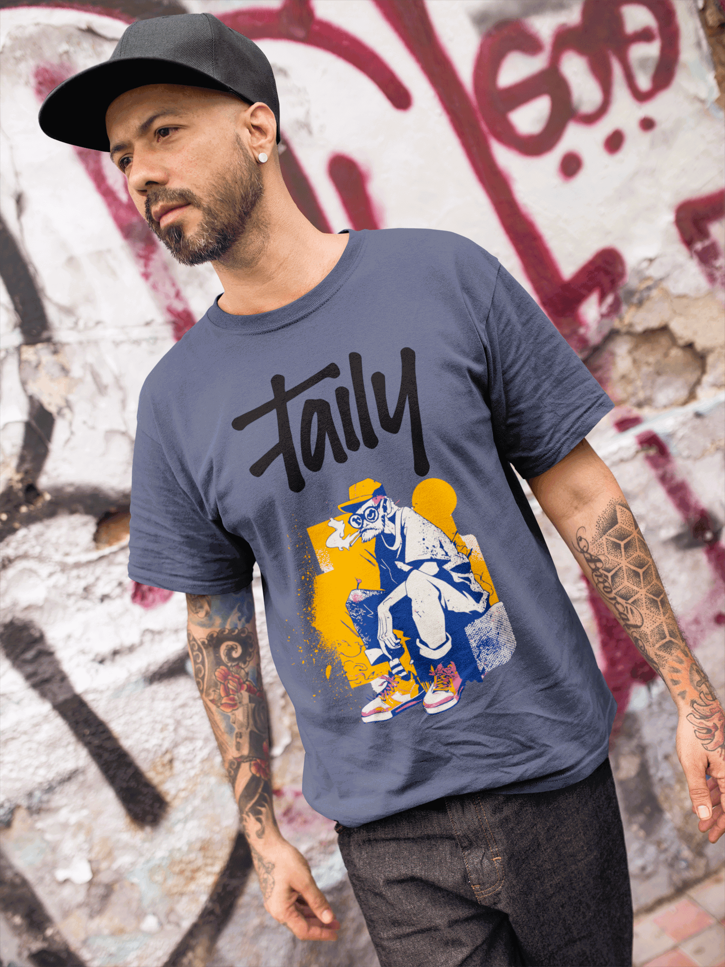 Man wearing Taily Street Rebel graphic tee in denim against graffiti background, showcasing streetwear style.