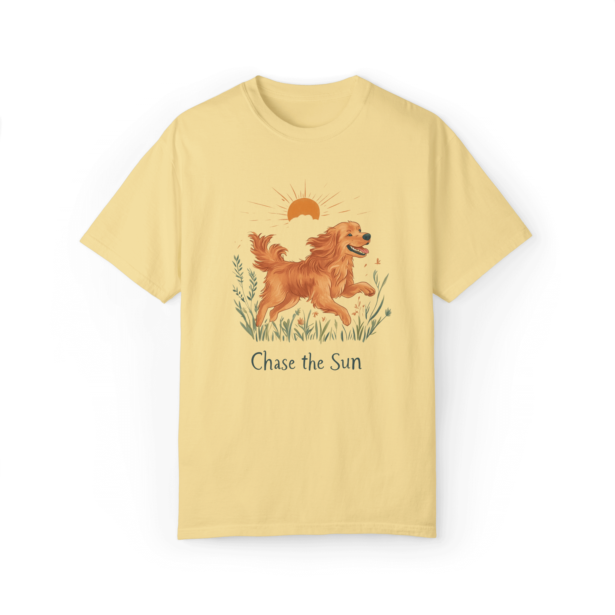 A yellow T-shirt featuring an illustration of a running golden retriever with a warm sun and natural wildflowers in the background, complemented by the text 