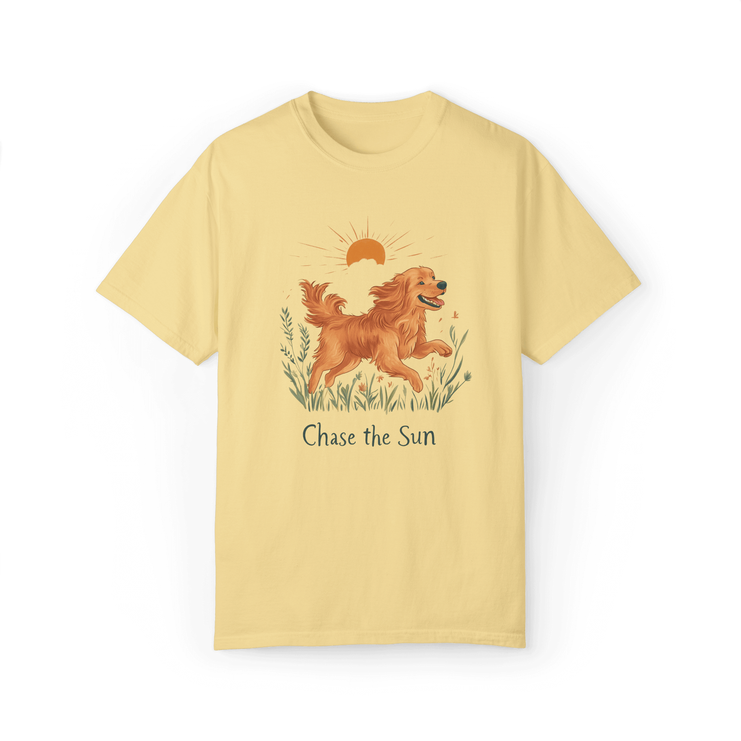 A yellow T-shirt featuring an illustration of a running golden retriever with a warm sun and natural wildflowers in the background, complemented by the text "Chase the Sun," reflecting a lifestyle of freedom and sunshine.