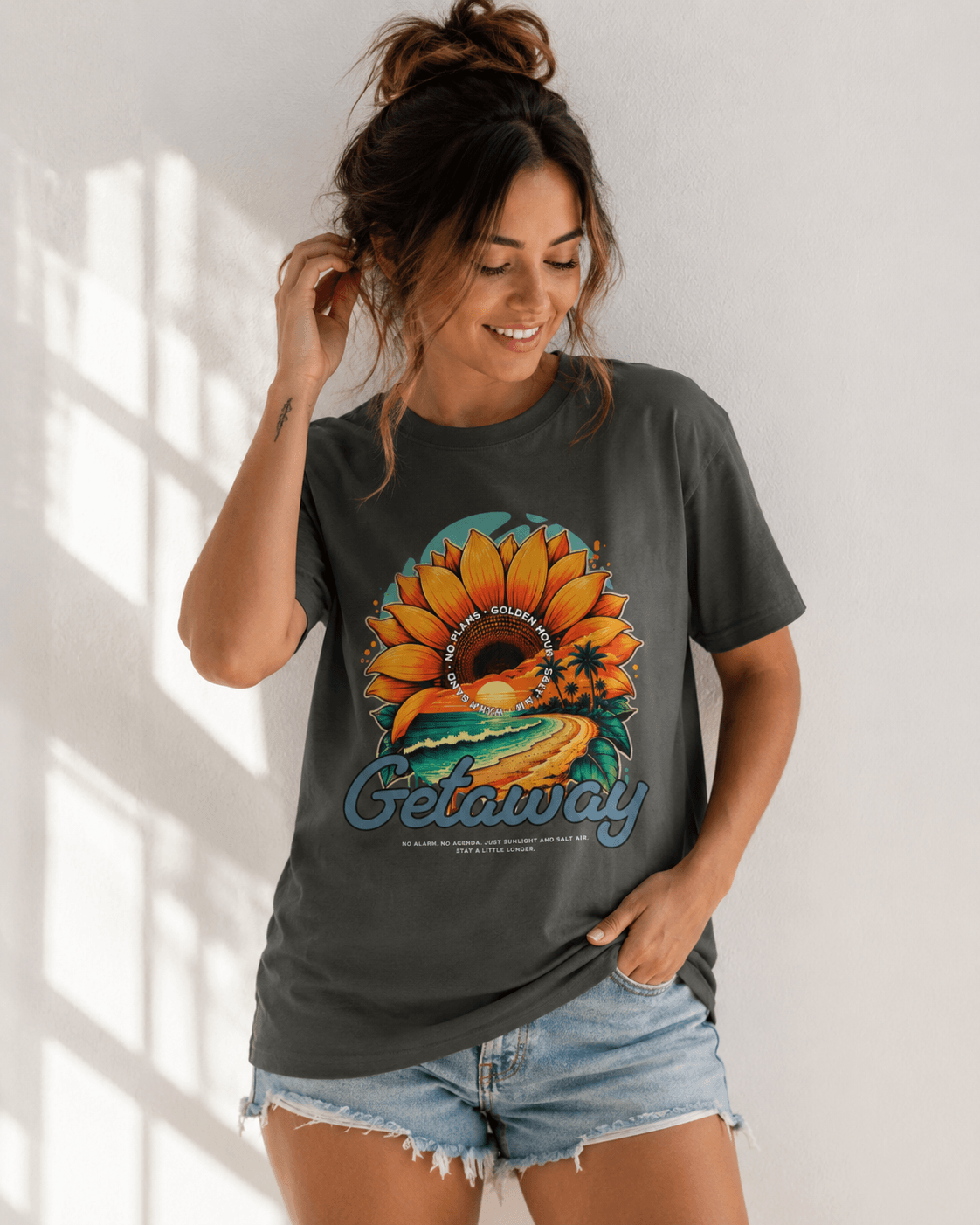 Getaway Sunflower Beach Tee – Pepper, featuring a vibrant sunflower design on a cozy gray shirt.