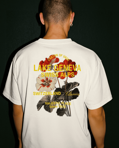 Back view of vintage boxy T-shirt featuring Lake Geneva Swiss Alps floral graphic and logo.