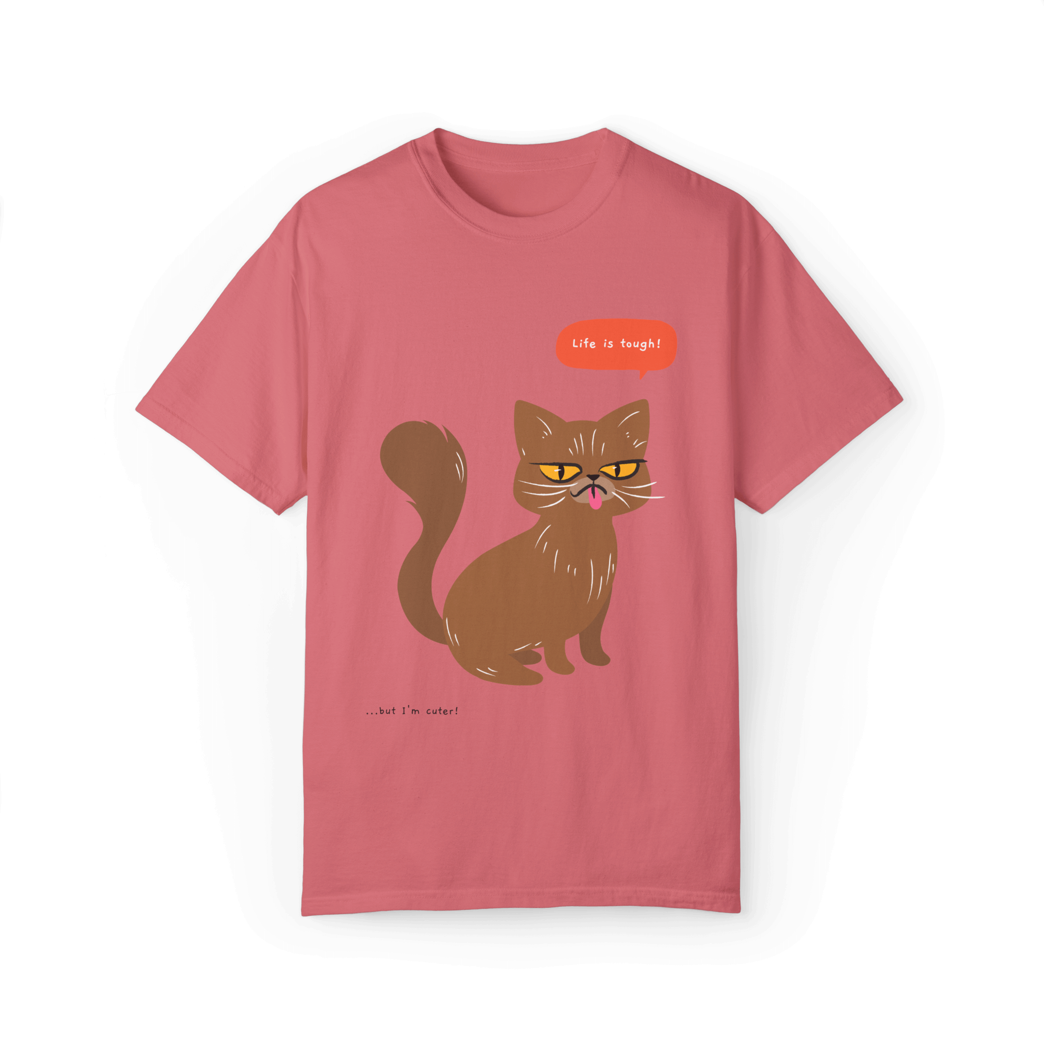 Pink T-shirt featuring a brown cat illustration with the phrase 'Life is tough!' and a humorous note '...but I'm cuter!