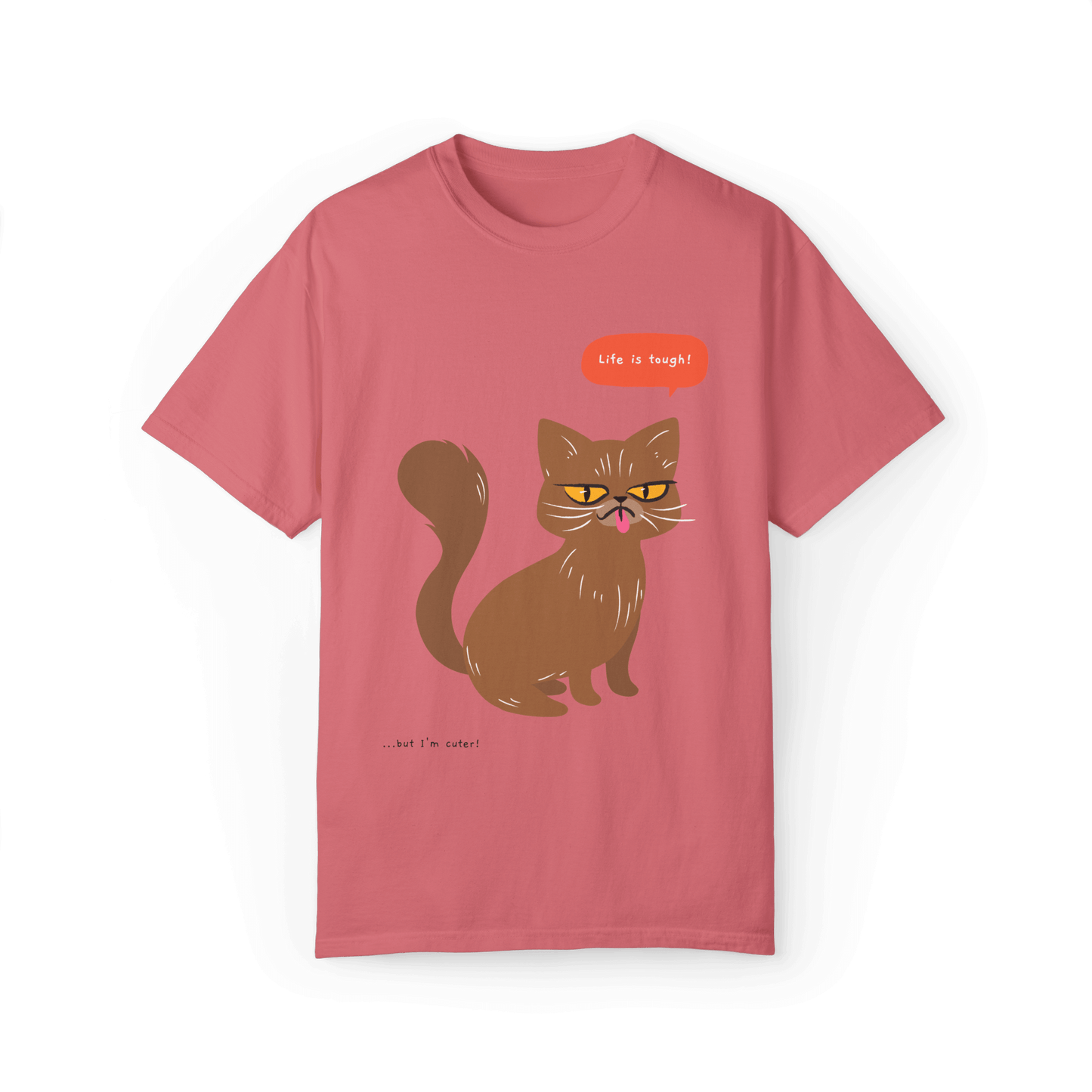 Pink T-shirt featuring a brown cat illustration with the phrase 'Life is tough!' and a humorous note '...but I'm cuter!