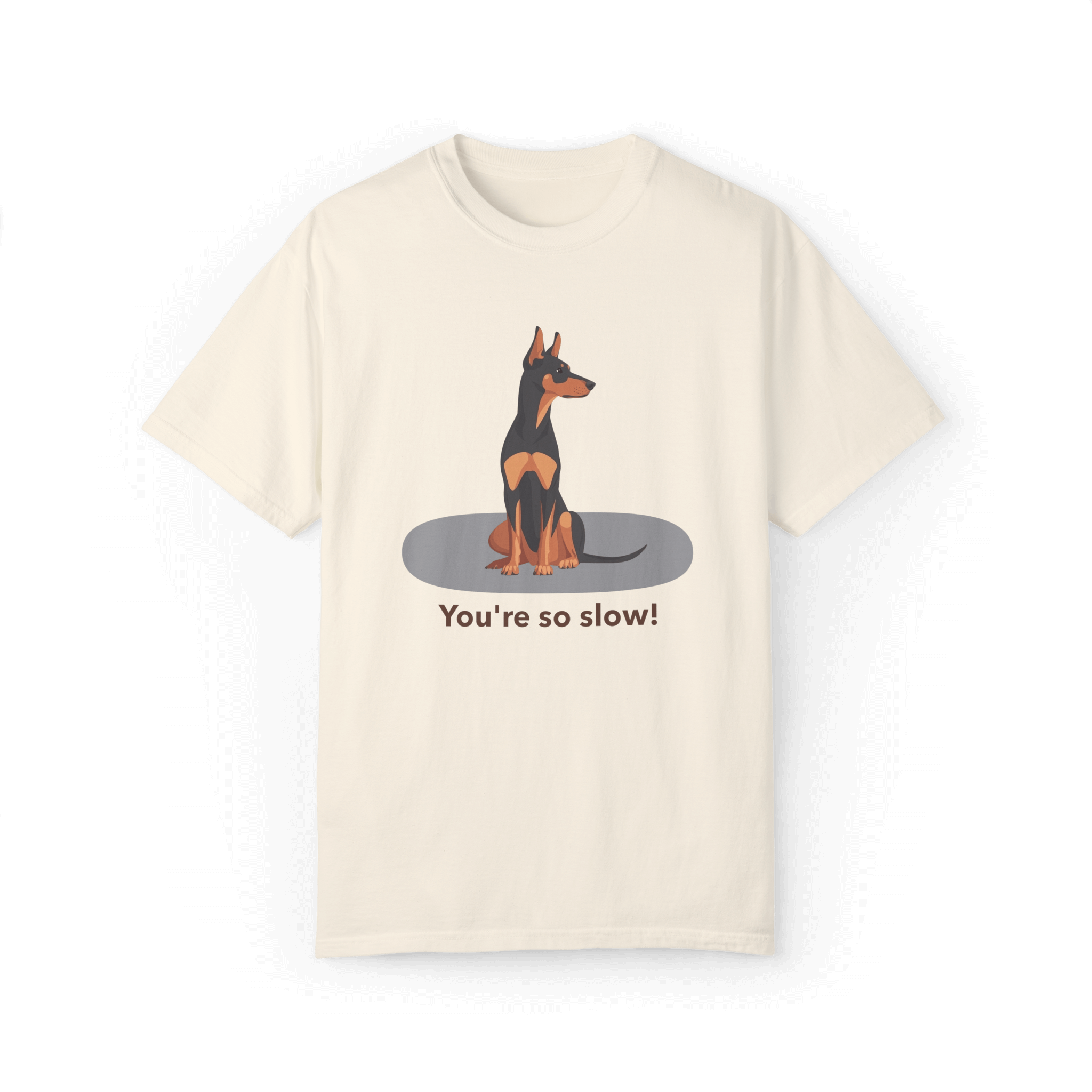 An off-white T-shirt featuring a cartoon Doberman illustration with the humorous text 