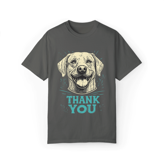 A gray T-shirt featuring a smiling dog illustration with the text "THANK YOU" below, combining a warm tone with a friendly message, perfect for casual wear.