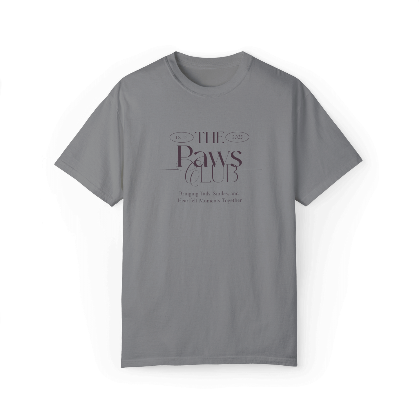 Gray T-shirt featuring 'The Paws Club' logo in elegant typography with the tagline 'Bringing Tails, Smiles, and Heartfelt Moments Together,' emphasizing a classic and minimalist style.