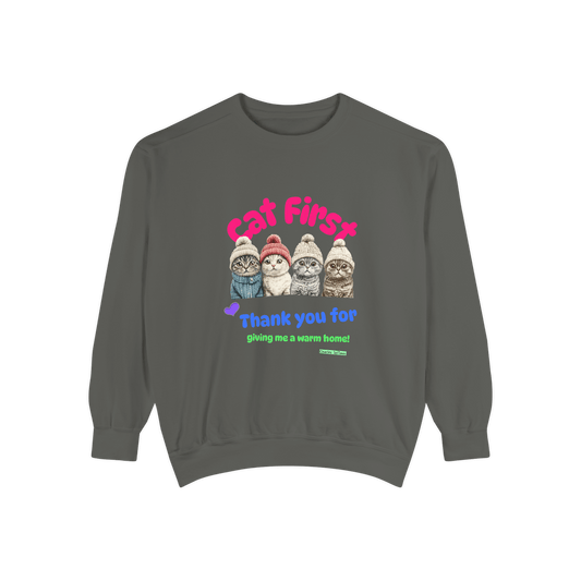 Gray sweatshirt with a colorful design featuring four Scottish Fold cats wearing knitted hats and the text 'Cat First' and 'Thank you for giving me a warm home!' displayed on a plain black background.