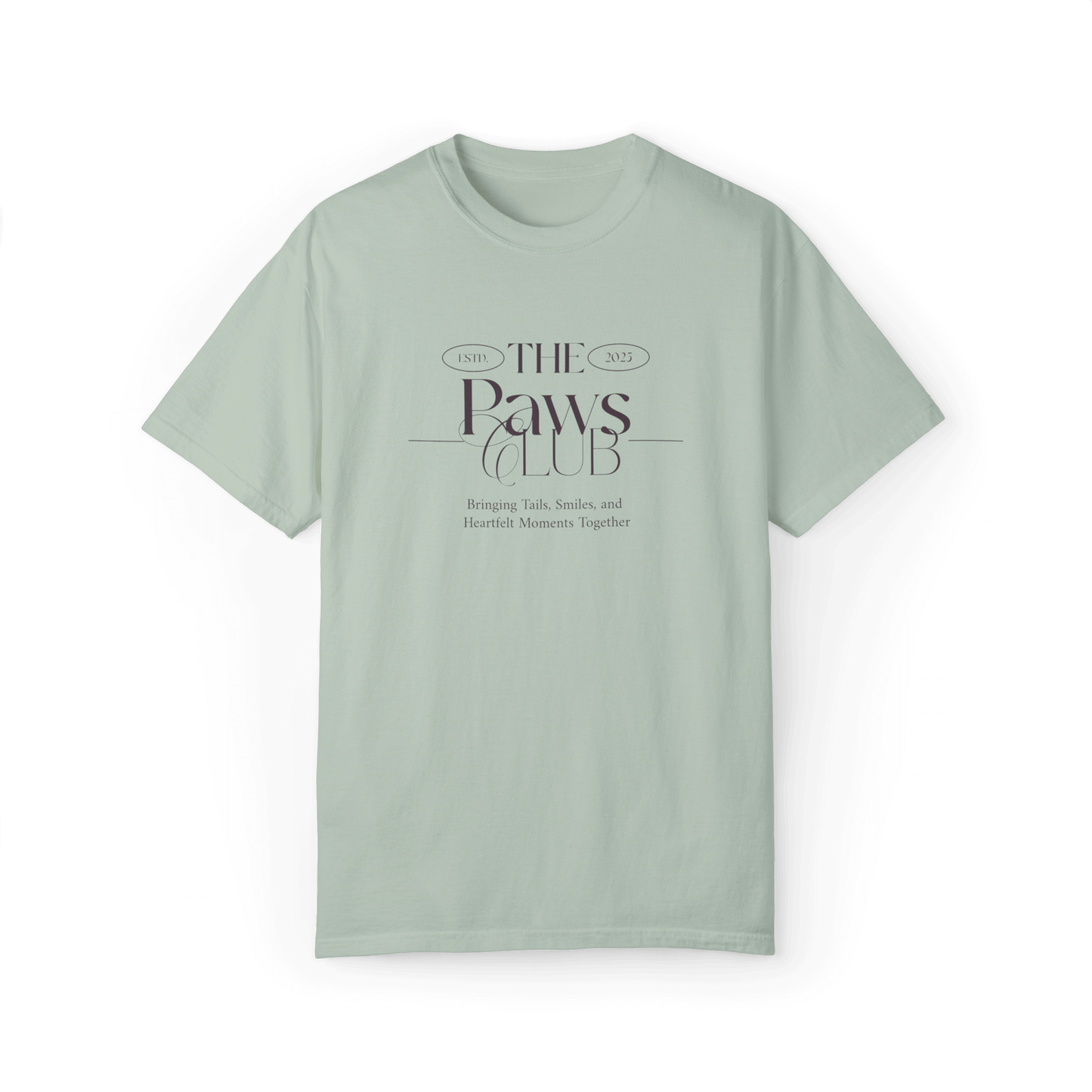 Light green T-shirt featuring 'The Paws Club' logo in refined typography with the tagline 'Bringing Tails, Smiles, and Heartfelt Moments Together,' showcasing an elegant and minimalist design.