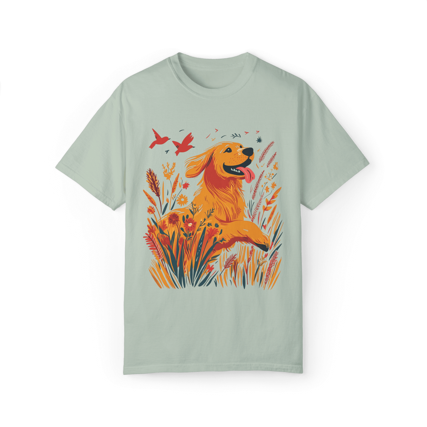 A light green T-shirt featuring a vibrant illustration of a golden retriever joyfully running through blooming wildflowers, with two red birds soaring in the sky, evoking a sense of nature and freedom.