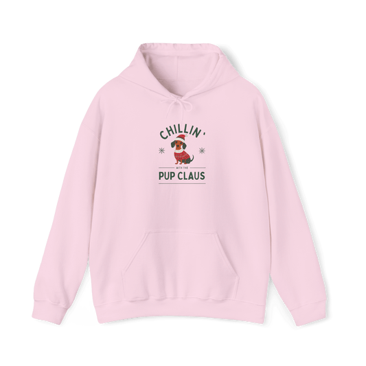 Cozy pink hoodie featuring 'Chillin' Pup Claus' design, perfect for festive holiday comfort and style.