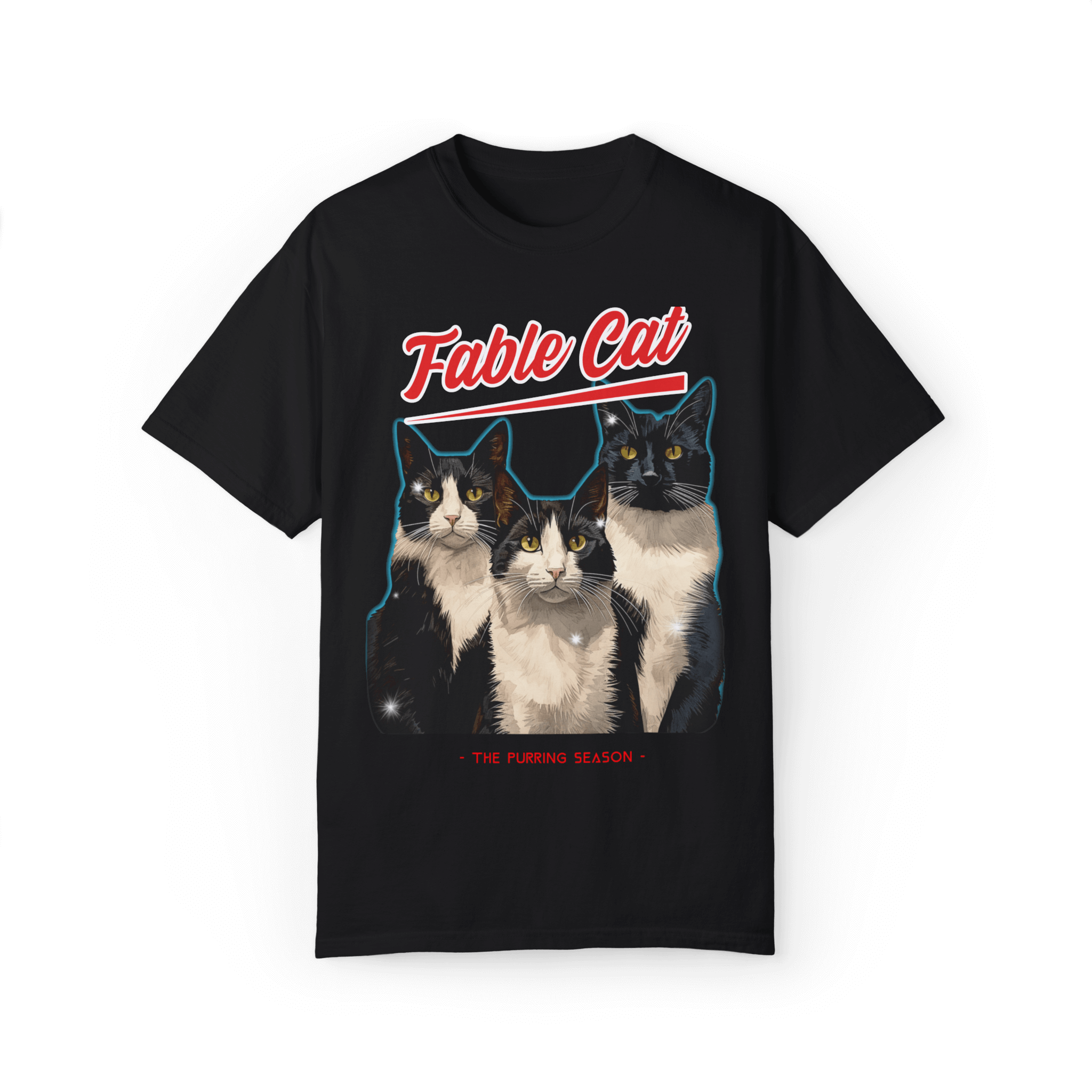 Black T-shirt with an illustration of three tuxedo cats, featuring the text 'Fable Cat' in bold red typography above and the subtitle 'The Purring Season' below.