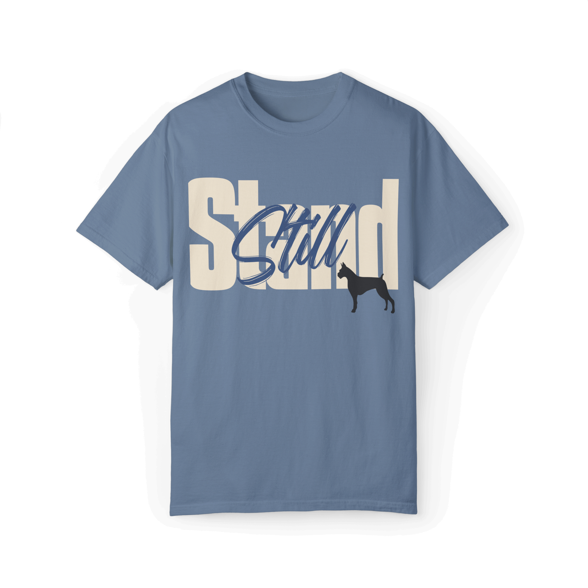 Light blue T-shirt featuring bold typography reading 'Stand Still' in white and blue, with a black dog silhouette integrated into the design.