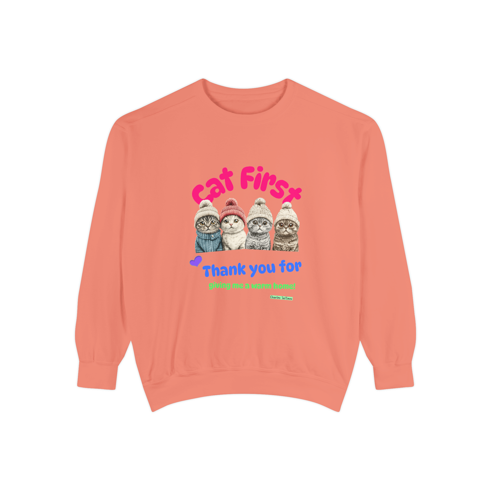 Coral sweatshirt featuring an illustration of four Scottish Fold cats wearing knitted hats, with colorful text 'Cat First' and 'Thank you for giving me a warm home!' underneath.