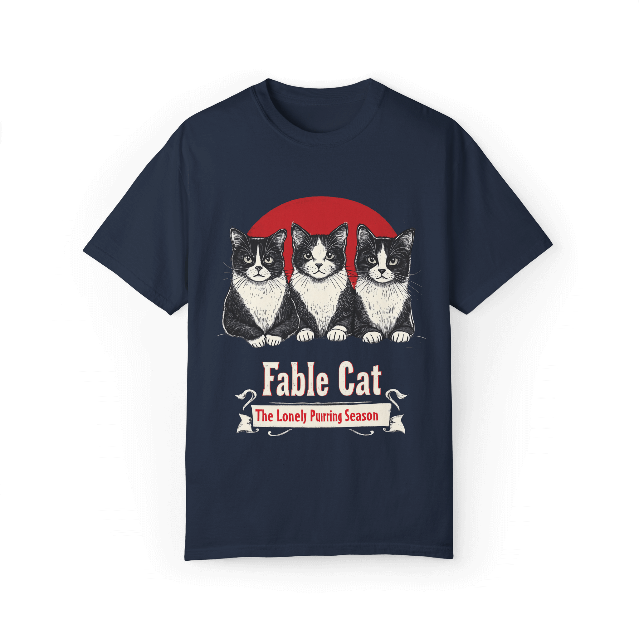 Navy blue T-shirt featuring a 'Fable Cat' design with three black-and-white cats sitting in front of a red circle, accompanied by the tagline 'The Lonely Purring Season.