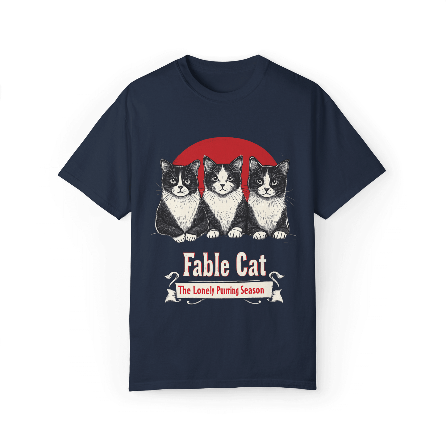 Navy blue T-shirt featuring a 'Fable Cat' design with three black-and-white cats sitting in front of a red circle, accompanied by the tagline 'The Lonely Purring Season.