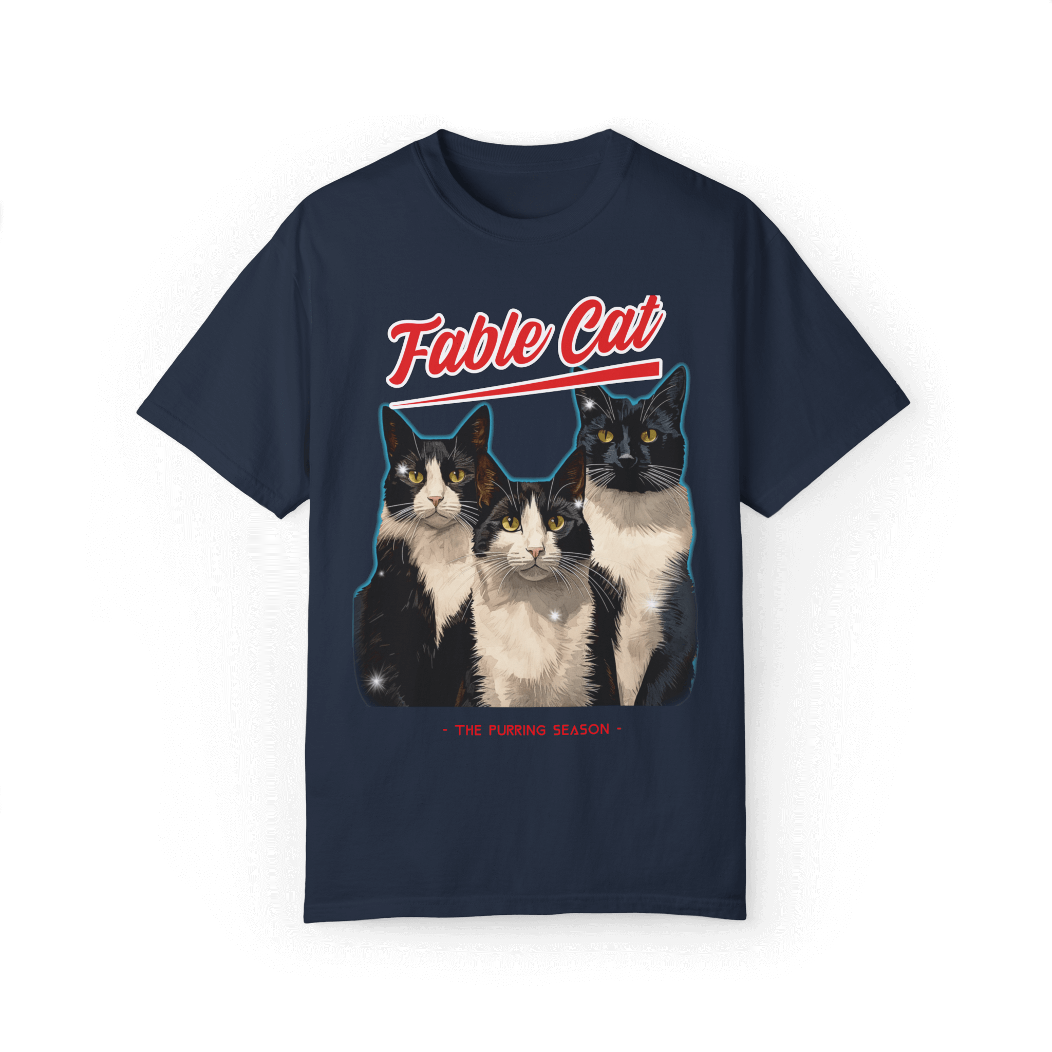 Black T-shirt featuring an illustration of three tuxedo cats, with bold red text 'Fable Cat' above and the subtitle 'The Purring Season' below.