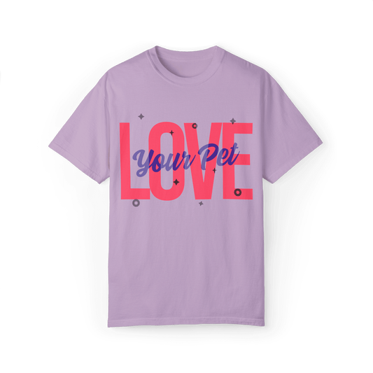 Lilac T-shirt featuring a bold design with the text 'Love Your Pet' in vibrant pink and blue, adorned with small geometric accents.