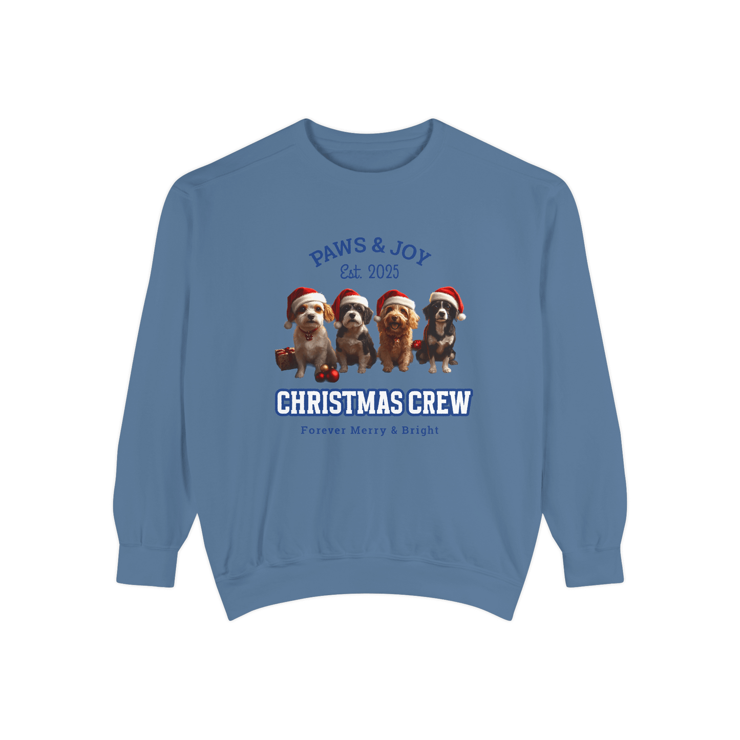 Blue Christmas-themed sweatshirt featuring the phrases "Paws & Joy Est. 2025" and "Christmas Crew," along with illustrations of four dogs wearing Santa hats, creating a joyful holiday vibe.