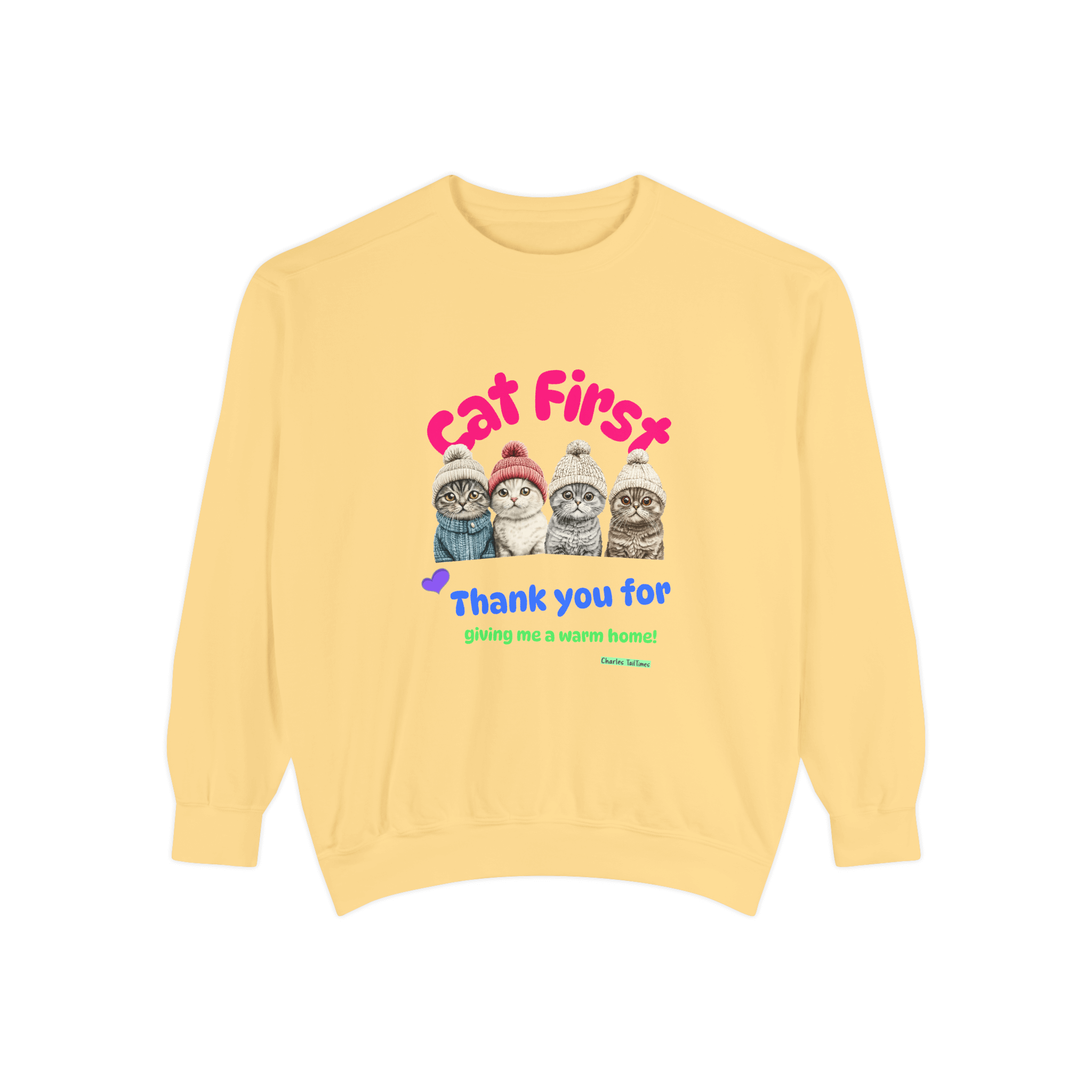 Yellow sweatshirt with a colorful design featuring four Scottish Fold cats wearing knitted hats and the text 'Cat First' and 'Thank you for giving me a warm home!' displayed on a plain black background.